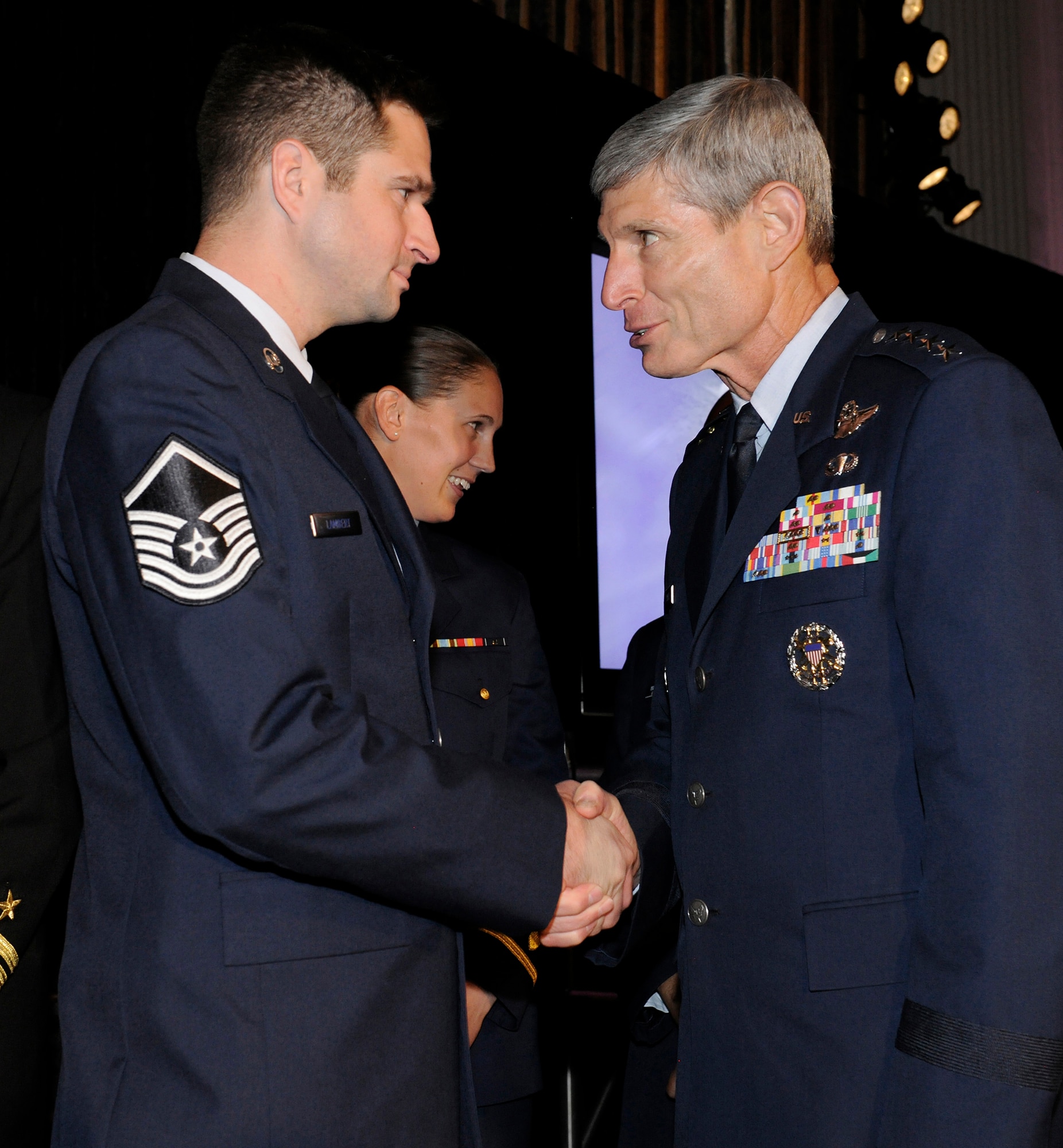 Air Force Chief of Staff Gen. Norton Schwartz congratulates Master Sgt. Brandon Lambert of the 728th Air Control Squadron, Eglin Air Force Base, Fla., on his selection as the 2012 Air Force Times Airman of the Year during the 2012 Military Times’ Service Members of the Year Awards awards ceremony July 19, 2012, in Washington, D.C.  (U.S. Air Force photo/Scott M. Ash)