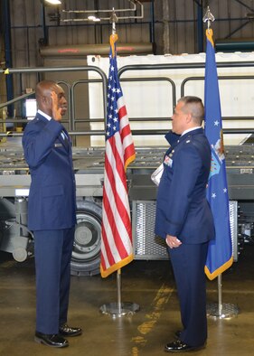 WRIGHT-PATTERSON AIR FORCE BASE, Ohio – Lt. Col John Marang, 87th Aerial Port Squadron commander, administers the oath of office to Tech. Sgt., now 1st Lt. Will Smith, 87th APS air transportation craftsman, during Smith’s commissioning ceremony May 19. (U.S. Air Force photo/Master Sgt. Charlie Miller)