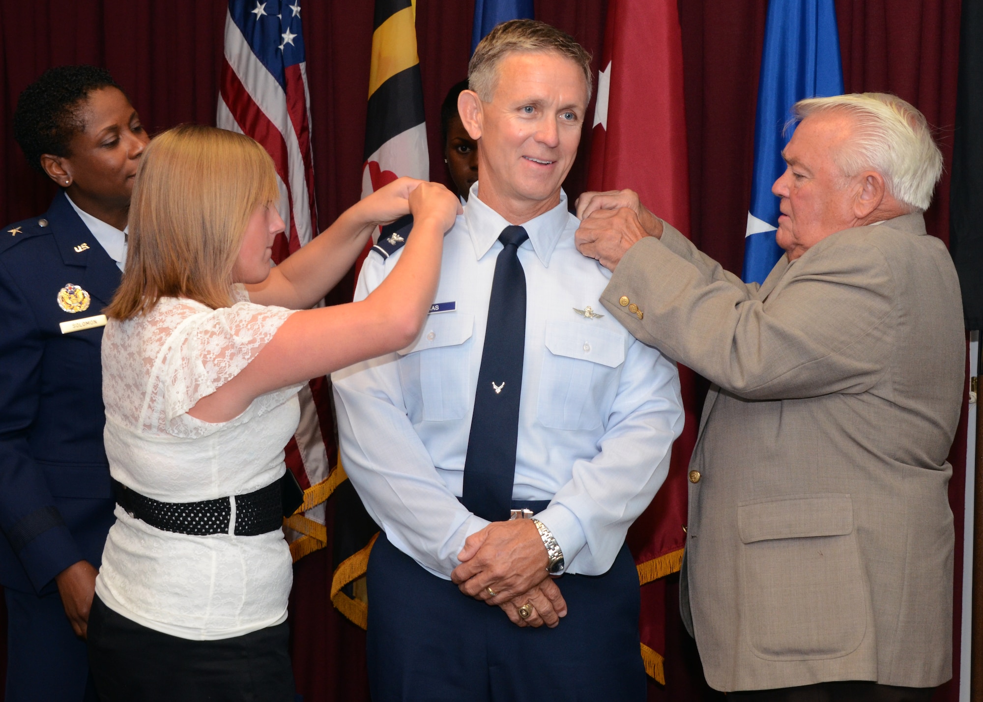 U.S. Air Force Col. Paul C. Maas Jr., Deputy Mission Support Group Commander, Maryland National Guard, was promoted to Brigadier General. His daughter and father changed his epaulets during his ceremony at Warfield Air National Guard Base, Baltimore, Md., on July 20, 2012.  (National Guard photo by Staff Sgt. Benjamin Hughes)