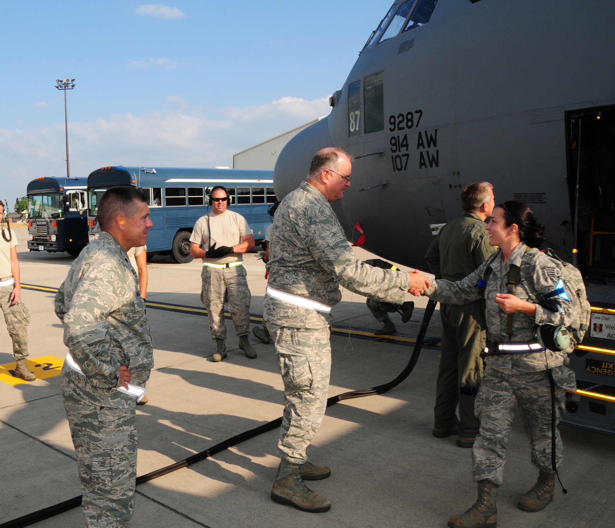 On July 24, 2012 It is all smiles as members from the 107th and 914th Airlift Wings return home. Both units deployed to Alpena, Michigan for thier Operational Readiness Inspection (ORI). Staff Sgt. Chelsey Berg 107th C-130 Aircraft Mechanic is greeted by Col. Timothy Vaughan, 107th Mission Support Group Commander and Lt. Col. Donald McGuire 107th Mission Support Group Deputy Commander. (U.S. Air Force Photo/SMSgt Ray Lloyd)