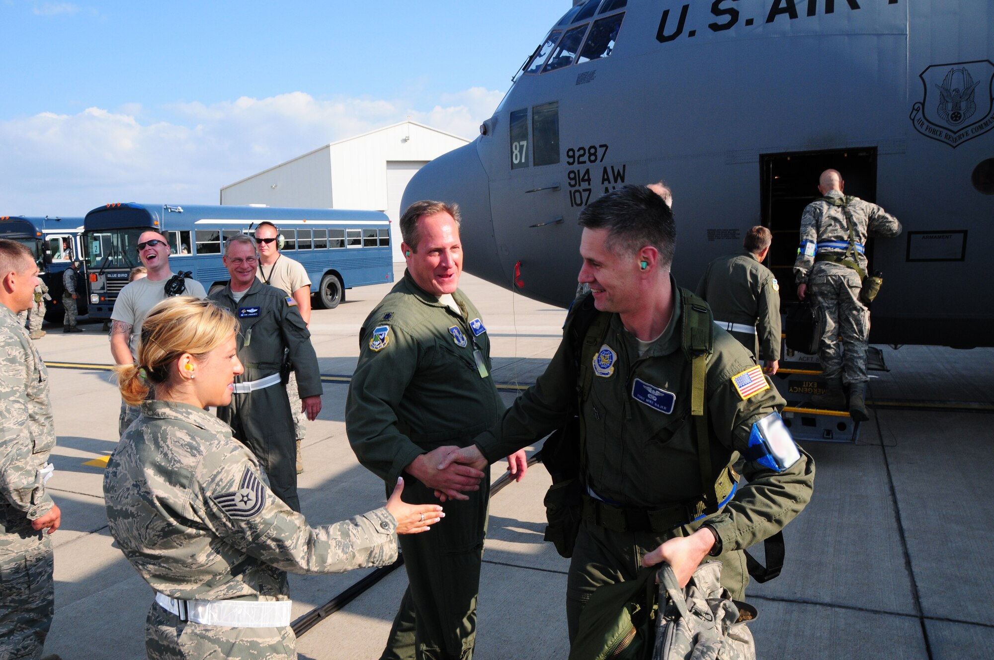 On July 24, 2012 It is all smiles as members from the 107th and 914th Airlift Wings return home. Both units deployed to Alpena, Michigan for thier Operational Readiness Inspection (ORI). Tech Sgt. Mike Bajer107th C-130 Flight Engineer  is greeted by Lt. Col. Dave Durkee, 107th Wing Plans  and Tech Sgt. Krystalore Stegner  107th Recruiter. (U. S. Air Force Photo/SMSgt Ray Lloyd)