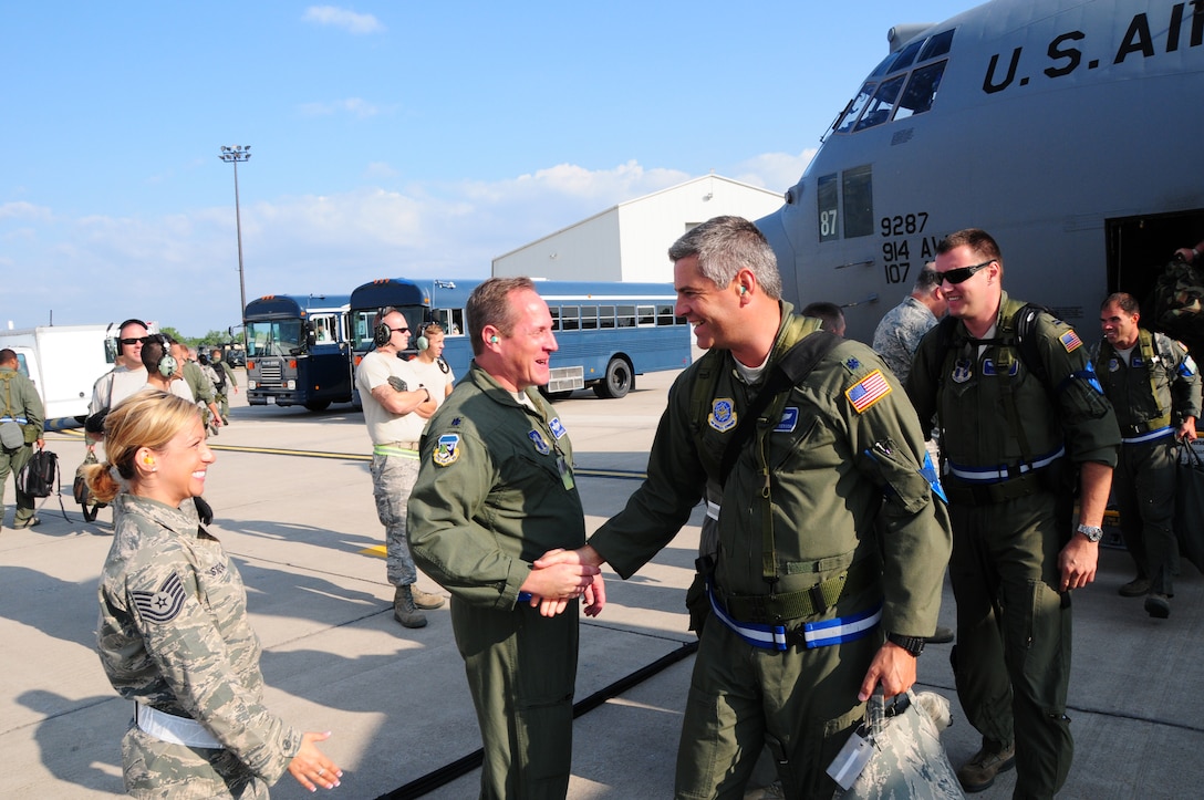 On July 24, 2012 It is all smiles as members from the 107th and 914th Airlift Wings return home. Both units deployed to Alpena, Michigan for thier Operational Readiness Inspection (ORI). 107th Air Crew Members Lt. Col John Patterson 107th C-130 Pilot, Capt. Dave Cline C-130 Navigator and Capt. William Thomas C-130 Pilot are greeted by Lt. Col. Dave Durkee, 107th Wing Plans and Tech Sgt. Krystalore Stegner 107th Recruiter. (U.S. Air Force Photo/SMSgt Ray Lloyd)