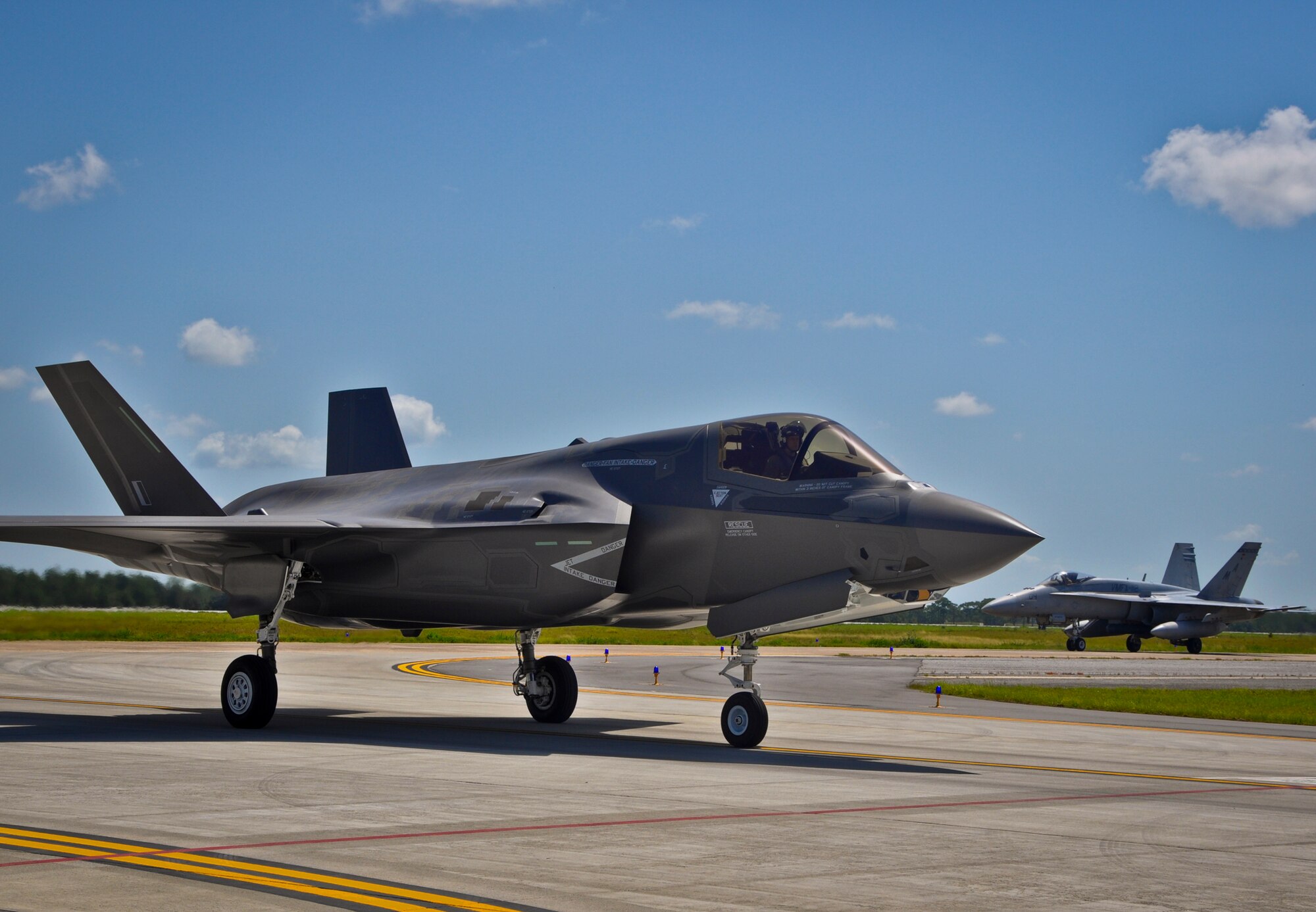 The first British F-35B Lightning II arrives at Eglin AIr Force Base, Fla., from Naval Air Station Fort Worth Joint Reserve Base, Texas, on July 23. The jet is the first of eight international partner variants of the joint strike fighter to be based at the 33rd Fighter Wing's F-35 integrated training center. British maintainers and pilots will be imbedded in Marine Fighter Attack Training Squadron 501 and the country’s pilot training begins this fall.  In the near future, they will be doing operation test preparation activity, leading the way for the U.K. to maintain the jets and becoming instructor pilots. The U.K. officially took ownership of the aircraft at a Lockheed Martin ceremony in Fort Worth, Texas, July 19.  (U.S. Air Force photo/Maj. Karen Roganov)