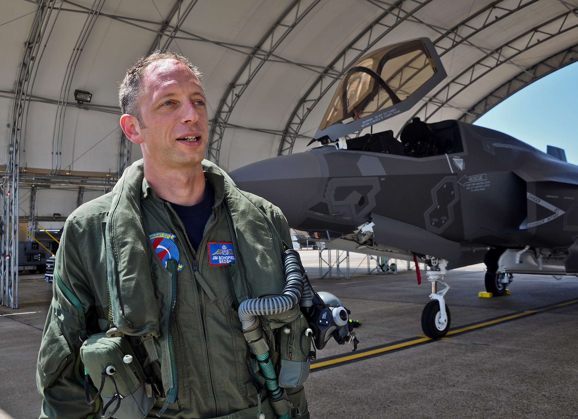 United Kingdom Royal Air Force Squadron Leader Jim Schofield poses for a photo after he piloted the first British F-35B Lightning II from Naval Air Station Fort Worth Joint Reserve Base, Texas, July 23. The jet is the first international variant of the joint strike fighter to be based at the 33rd Fighter Wing, Eglin Air Force Base, Fla. U.K. maintainers and pilots will be imbedded in the  Marine Fighter Attack Training Squadron 501 and U.K. pilot training begins this fall.  In the near future, the U.K. will be doing operation test preparation activity, leading the way to maintain the jets and becoming instructor pilots. .The U.K. officially took ownership of the aircraft at a Lockheed Martin ceremony in Fort Worth, Texas, July 19.  (U.S. Air Force photo/Maj. Karen Roganov)