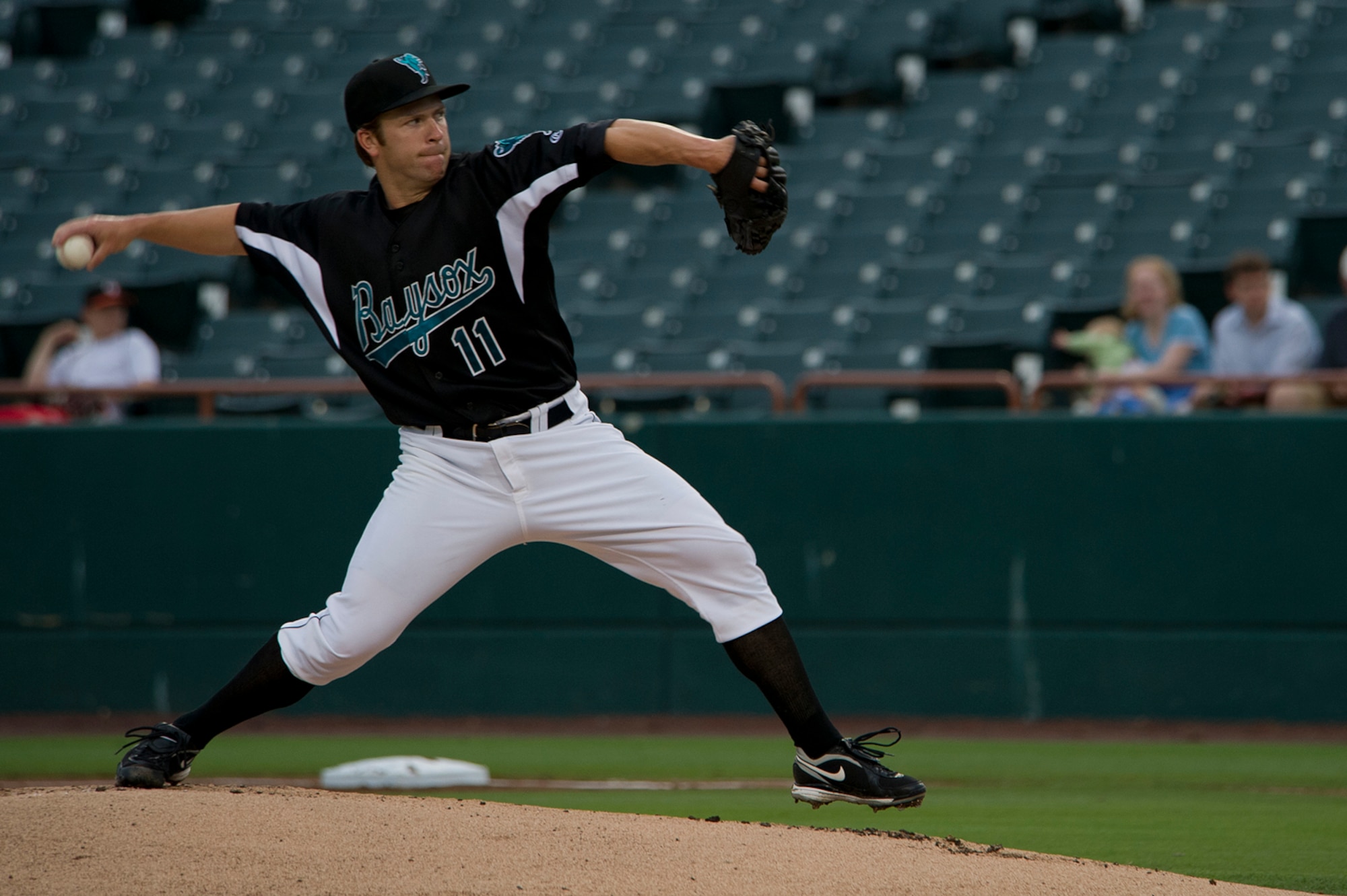Zach Clark, Bowie Baysox pitcher, throws a curveball July 20, 2012, in Bowie, Md.  The Baysox celebrated Andrews Night and Heroes Night where Airmen, Soldiers, Sailors and Marines from Joint Base Andrews as well as Police, firefighters and first responders from the community were honored throughout  the game. (U.S. Air Force photo/Senior Airman Perry Aston)
