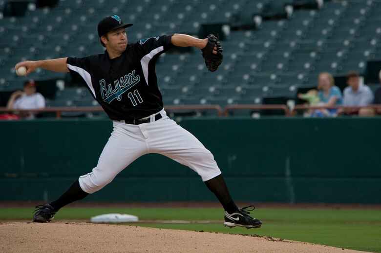 Zach Clark, Bowie Baysox pitcher, throws a curveball July 20, 2012, in Bowie, Md.  The Baysox celebrated Andrews Night and Heroes Night where Airmen, Soldiers, Sailors and Marines from Joint Base Andrews as well as Police, firefighters and first responders from the community were honored throughout  the game. (U.S. Air Force photo/Senior Airman Perry Aston)
