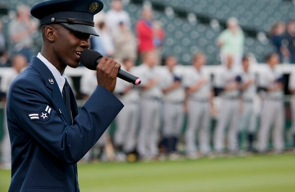Airman 1st Class Andre Petway, USAF Honor Guard ceremonial guardsman, sings the National Anthem July 20, 2012 at the Bowie Baysox stadium in Bowie, Md. The Baysox celebrated Andrews Night and Heroes Night where Airmen, Soldiers, Sailors and Marines from Joint Base Andrews as well as Police, firefighters and first responders from the community were honored throughout  the game. (U.S. Air Force photo/Senior Airman Perry Aston)
