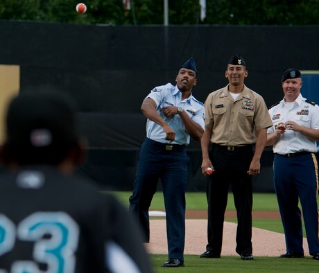 Senior Airman Marquis Smith, Petty Officer First Class Jamie Zhunepluas, and Army Staff Sgt. Neil Percifull throw the first pitches July 20, 2012 at the Bowie Baysox stadium
in Bowie, Md. The Baysox celebrated Andrews Night and Heroes Night where Airmen, Soldiers, Sailors and Marines from Joint Base Andrews as well as Police, firefighters and first responders from the community were honored throughout  the game. (U.S. Air Force photo/Senior Airman Perry Aston)
