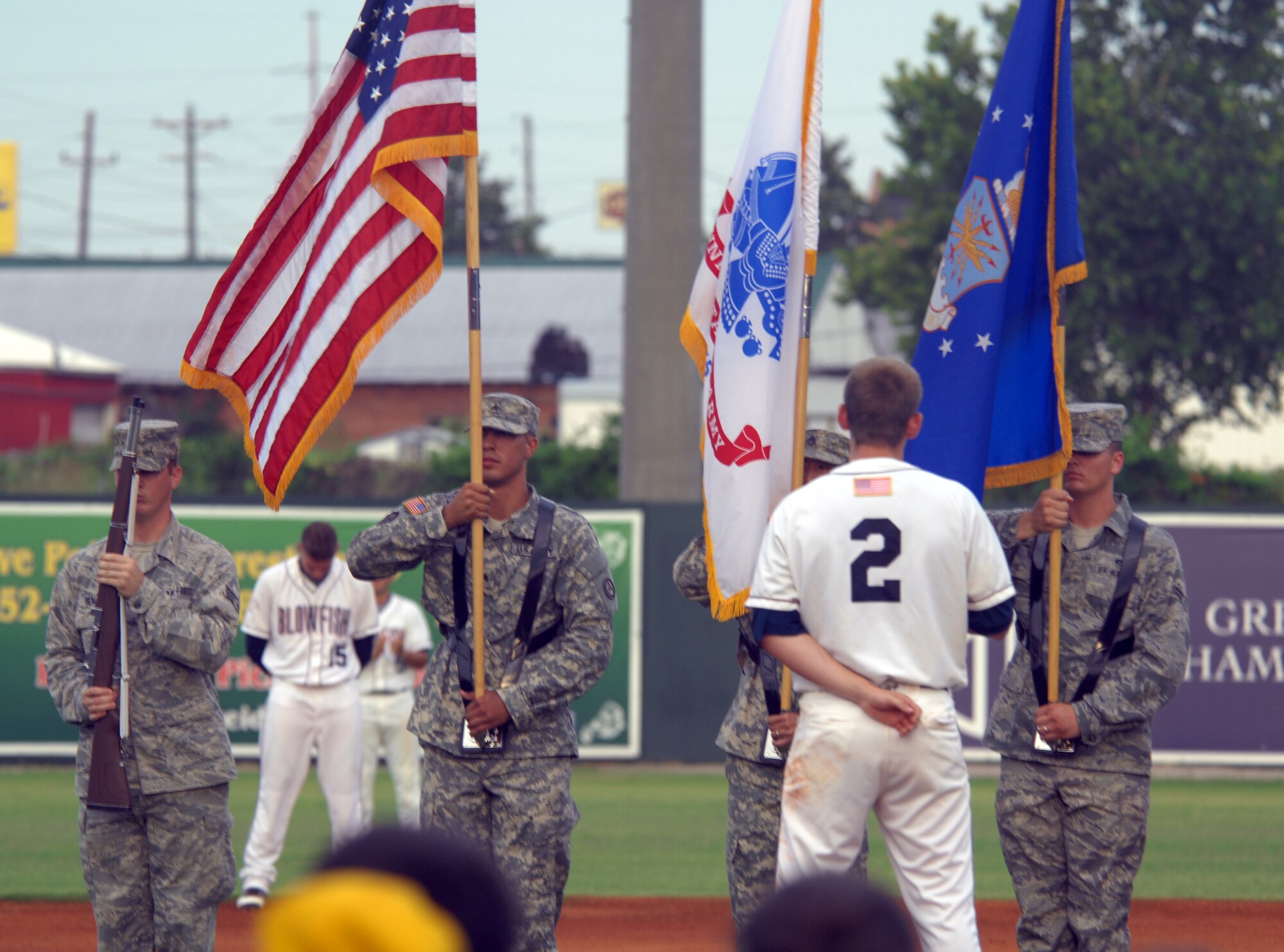Members of a Team Shaw color guard present the colors for the opening ceremony of the "Team Shaw Appreciation Night", July 21, 2012, at Columbia's Capital City Stadium. The ceremony opened for the Blowfish's game against the Gastonia Grizzlies. (U.S. Air Force Photo/ Senior Airman Neil D. Warner/Released)



