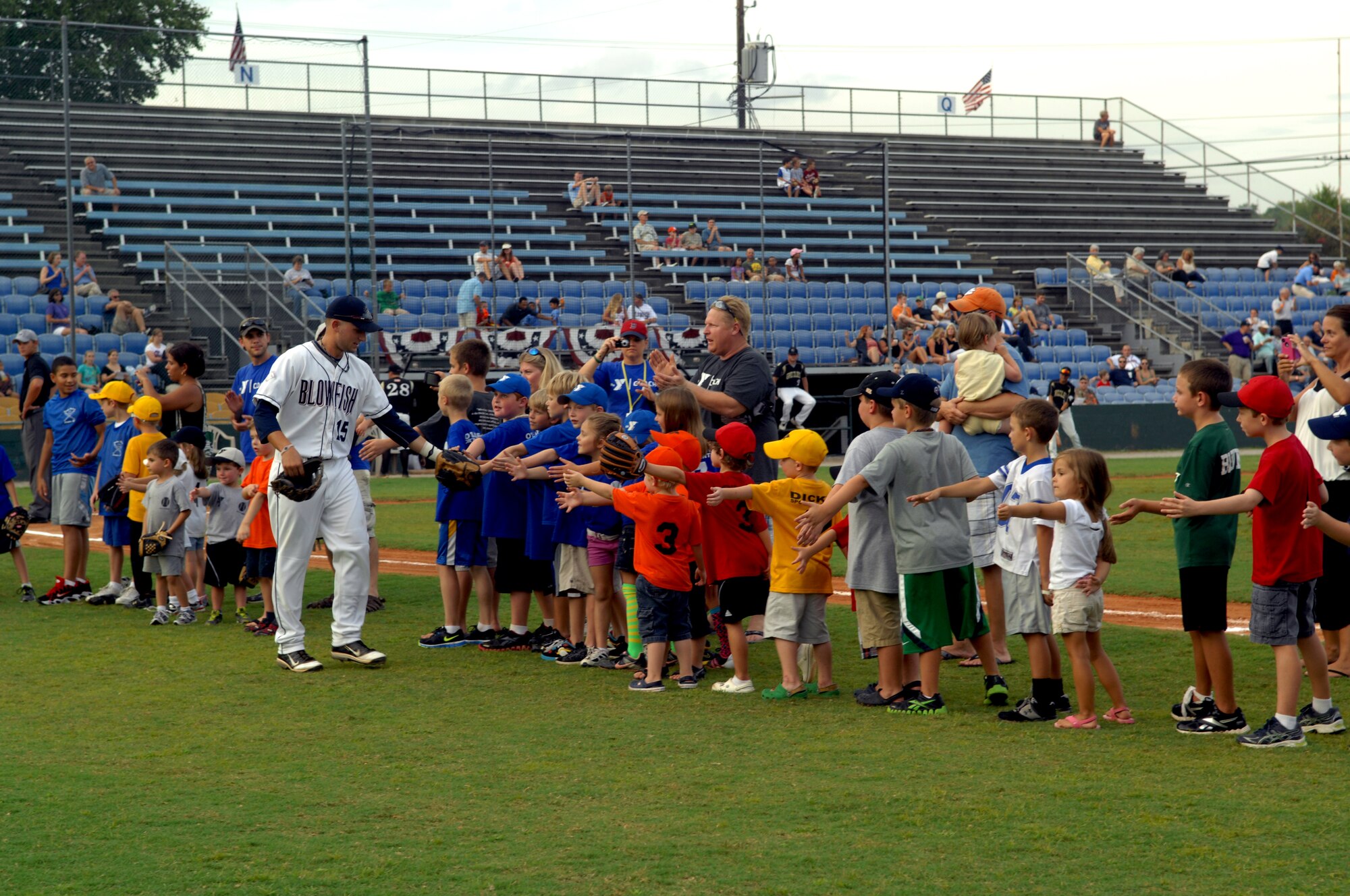 The "Team Shaw Appreciation Night" began at 7 p.m., July 21, 2012, as children met the players. Afterwards members of Team Shaw headlined the opening ceremonies for the Columbia Blowfish's game against the Gastonia Grizzlies. (U.S. Air Force Photo/ Senior Airman Neil D. Warner/Released)



