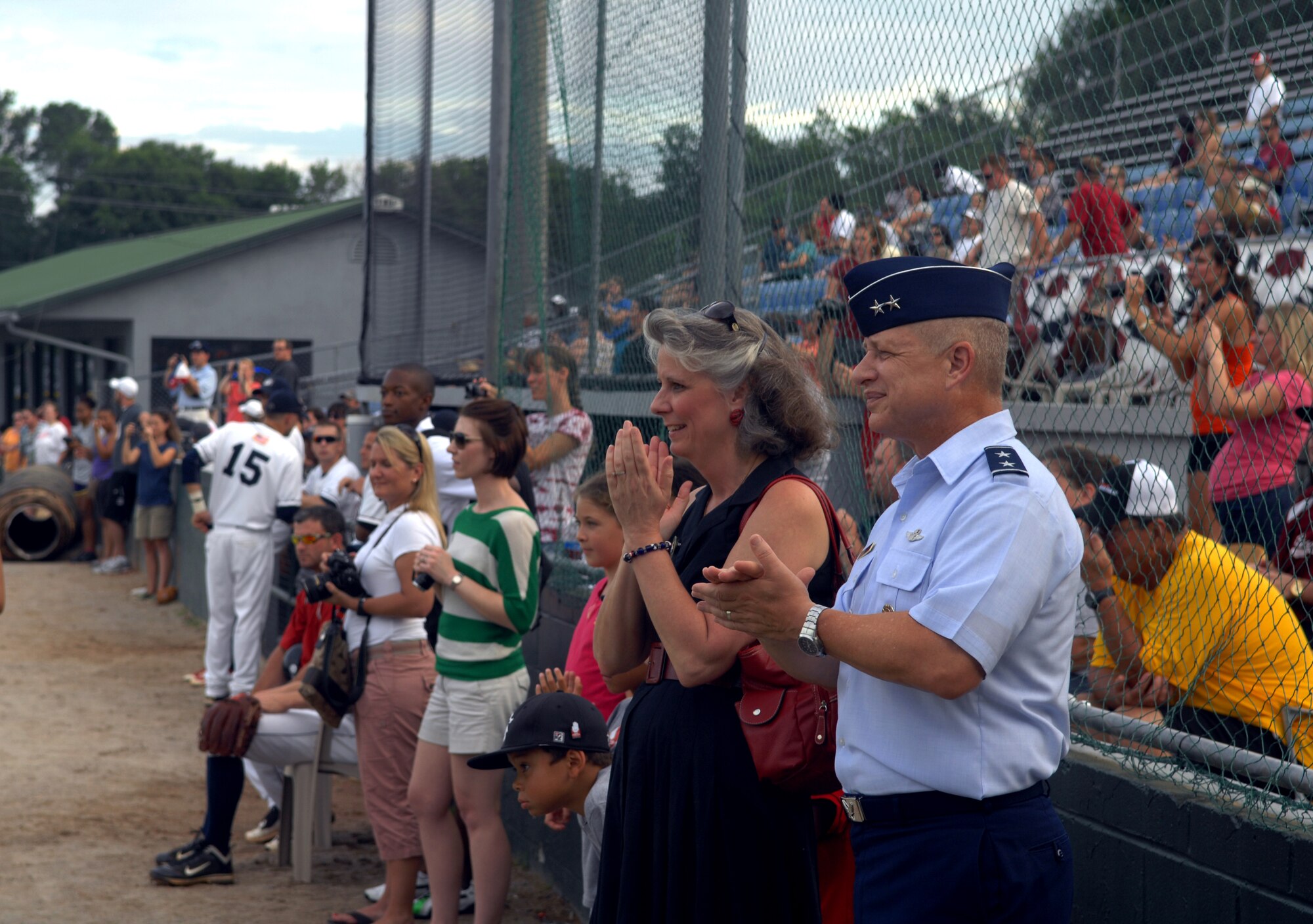U.S. Air Force Maj. Gen. Lawrence Wells, 9th Air Force commander, watches the "Team Shaw Appreciation Night" opening ceremonies accompanied by his wife Kathy, July 21, 2012. Airmen and Soldiers from Team Shaw, which includes the 20th Fighter Wing, 9th Air Force/AFCENT and Third Army/ARCENT, were all honored by the Blowfish. (U.S. Air Force Photo/ Senior Airman Neil D. Warner/Released)



