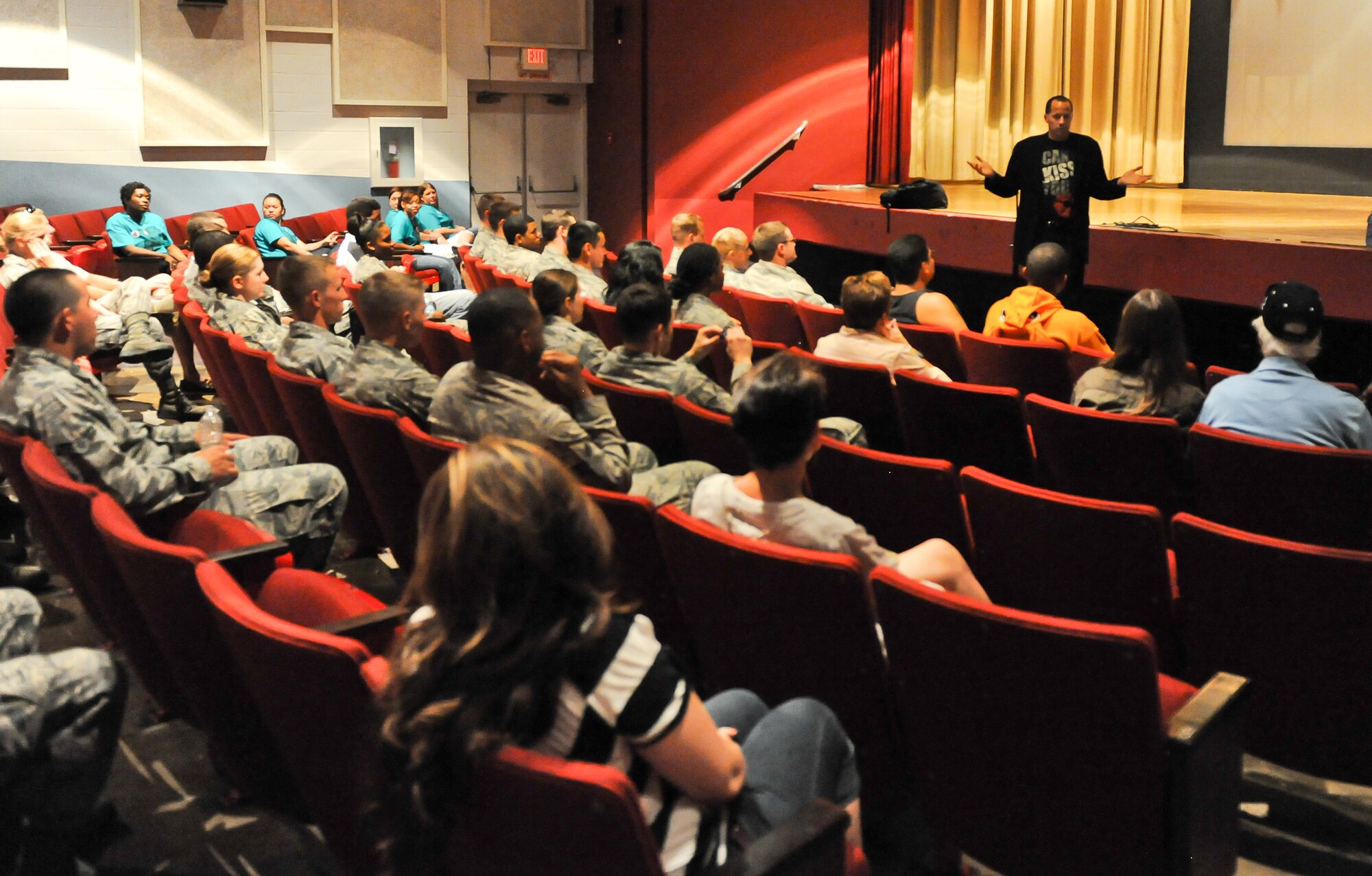 Mike Domirtz, founder of the Date Safe Project, speaks to Airmen and family members during a presentation entitled, “May I Kiss You?” in the base theater on Ellsworth Air Force Base, S.D., July 20, 2012. The engaging presentation is an educational comedy act designed to raise awareness of- and prevent- sexual assault, encourage bystander intervention and teach how to communicate effectively. (U.S. Air Force photo by Airman 1st Class Kate Thornton/Released)