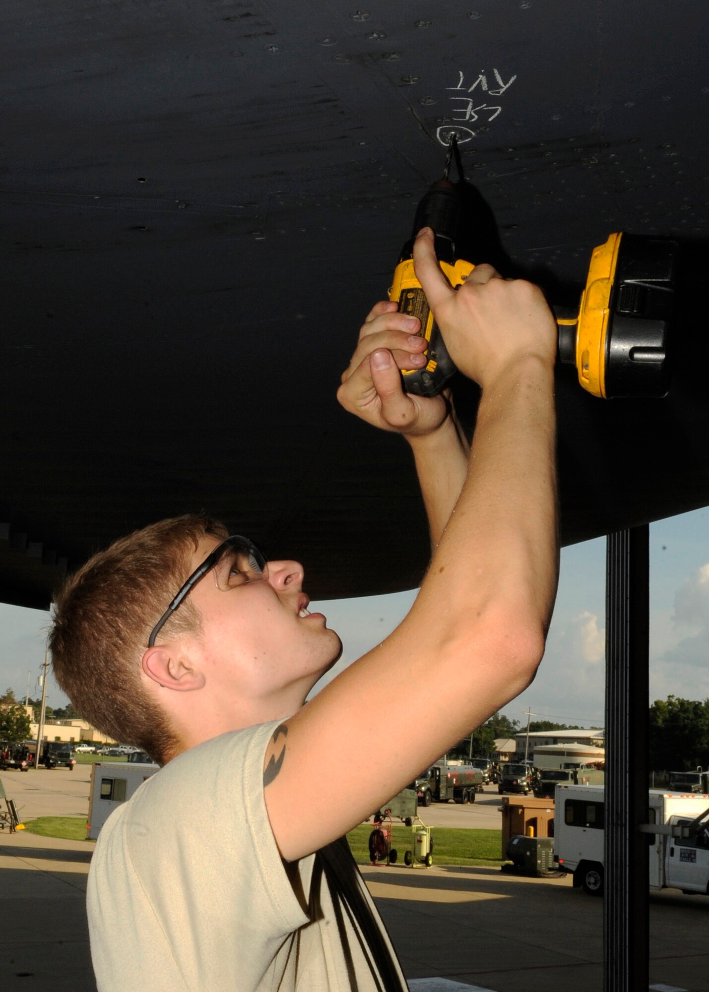 Senior Airman Joshua Martinez, 2nd Maintenance Squadron aircraft structural maintenance journeyman, removes a jobolt rivot from the horizontal wing on a B-52H Stratofortress on Barksdale Air Force Base, La., July 23. Martinez replaced the loose jobolt on the B-52H to prevent further damage and to keep the aircraft panels intact. (U.S. Air Force photo/Airman 1st Class Joseph A. Pagán Jr.)(RELEASED)