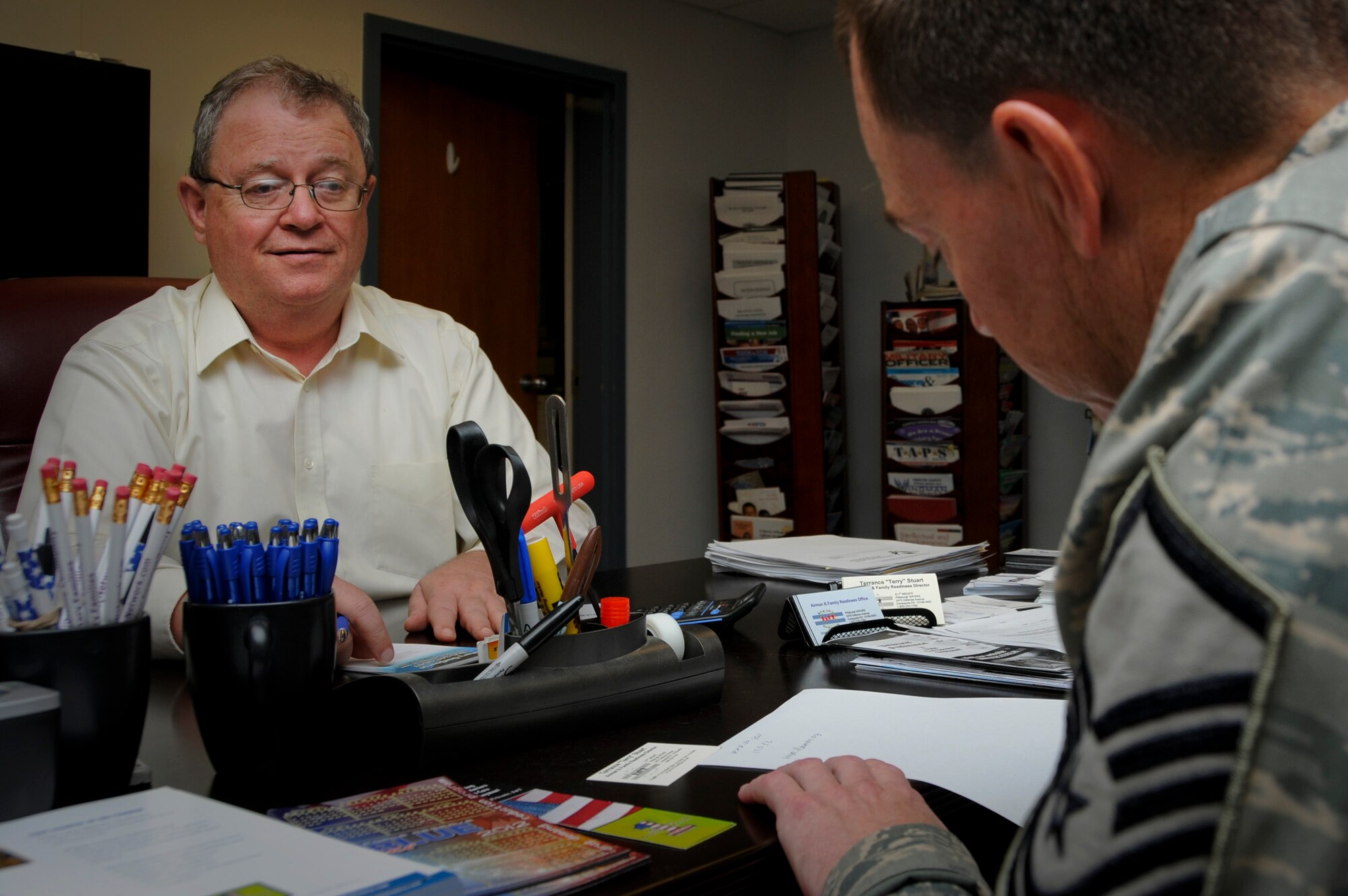 Terry Stuart, Airman and Family Readiness Center director, discusses veterans’ benefits with a 911th Airlift Wing Airman at the Airman and Family Readiness Center, here, July 18, 2012. The Airman and Family Readiness Center assists all Airmen and their family members in many aspects of life; including financial, employment, educational, deployment and relocation matters. They also ensure families are referred to the correct people that can assist them in other areas, where they are unable to assist the Airman and/or family members. (U.S. Air Force photo by Senior Airman Joshua J. Seybert/Released)