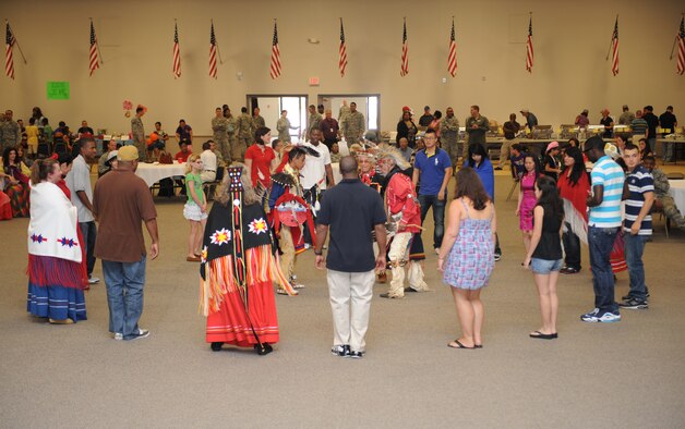 The Adai Caddo, a Native American tribe, and members of Team Barksdale gather in the middle of Hoban Hall to perform a Native American dance during Multicultural Day on Barksdale Air Force Base, La., July 20. The Adai Caddo Indian Nation has more than 1,200 tribal members from all across the nation. (U.S. Air Force photo/Airman 1st Class Benjamin Gonsier)(RELEASED)