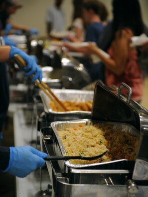 Fried rice and other ethnic foods are prepared for Barksdale Airmen and their families during Multicultural Day on Barksdale Air Force Base, La., July 20. Fried rice, a popular Asian dish, was also served with gyoza, commonly known as pot stickers. (U.S. Air Force photo/Airman 1st Class Benjamin Gonsier)(RELEASED)