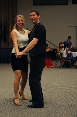 Amanda Burg and Stephen Mackey, professional dancers, perform a Latin American dance during Multicultural Day on Barksdale Air Force Base, La., July 20. Burg and Mackey performed various Latin American dances such as the meringue, bachata, cha-cha and salsa for members of Team Barksdale. (U.S. Air Force photo/Airman 1st Class Benjamin Gonsier)(RELEASED)