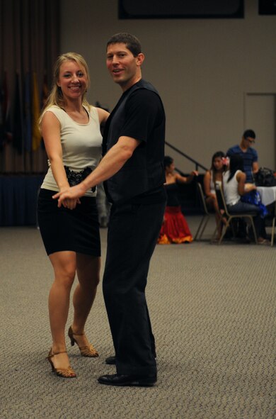 Amanda Burg and Stephen Mackey, professional dancers, perform a Latin American dance during Multicultural Day on Barksdale Air Force Base, La., July 20. Burg and Mackey performed various Latin American dances such as the meringue, bachata, cha-cha and salsa for members of Team Barksdale. (U.S. Air Force photo/Airman 1st Class Benjamin Gonsier)(RELEASED)