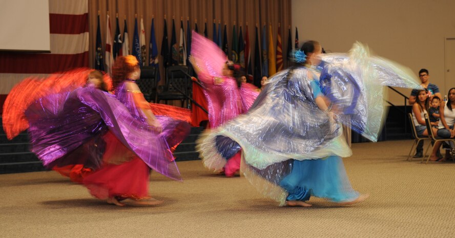 The Gems of Cairo perform a dance routine for members of Team Barksdale during Multicultural Day on Barksdale Air Force Base, La., July 20. The group, based in Shreveport, La., performs Egyptian-style folkloric and cabaret dance. Their name is derived from the city of Cairo, which is the capital of Egypt, and the largest city in the Arab world. They performed various types of dances including Middle Eastern, Spanish Flamenco, gypsy-style and many more. (U.S. Air Force photo/Airman 1st Class Benjamin Gonsier)(RELEASED)