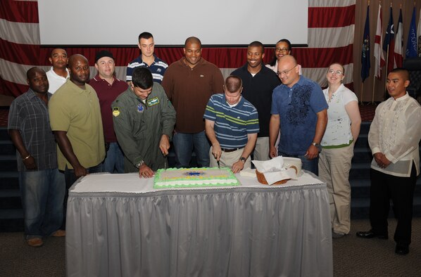 Col. Andrew Gebara, 2nd Bomb Wing commander, and Master Sgt. Darren Mitchell, 608th Air Communications Squadron, cut a cake to kick off Multicultural Day on Barksdale Air Force Base, La., July 20. Multicultural Day is an annual event that celebrates the diversity of Barksdale Airmen and their families. (U.S. Air Force Photo/Airman 1st Class Benjamin Gonsier)(RELEASED)