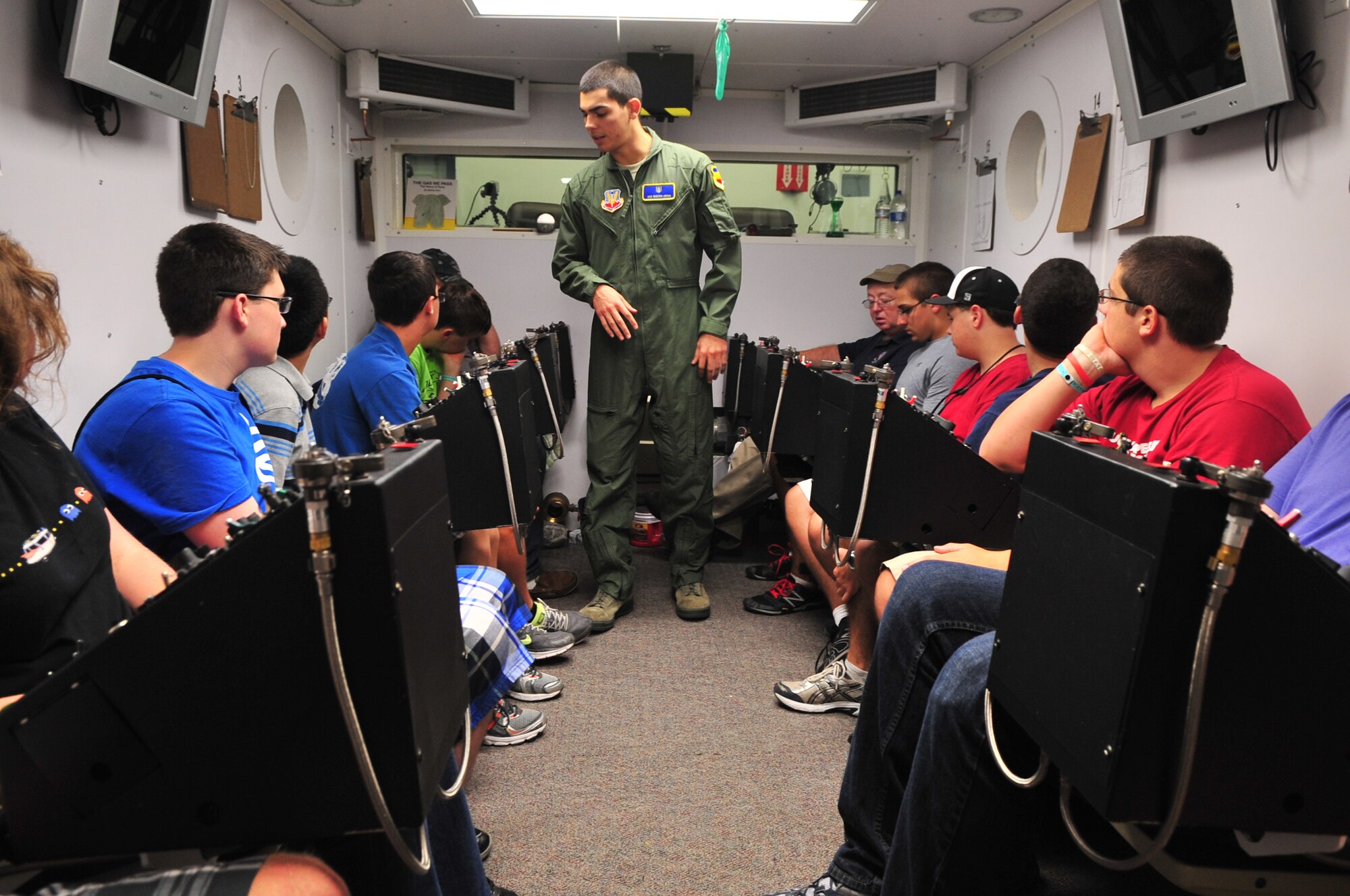 U.S. Air Force Airman 1st Class Dustin Urias, 20th Aerospace Medicine Squadron aerospace physiology journeyman, talks with a group of high school students in aviation aerospace summer camp, Shaw Air Force Base, S.C., July 18, 2012. The group had the opportunity to tour several places on the base to experience how the military works and the role Shaw plays in the big picture. (U.S. Air Force photo by Airman 1st Class Ashley L. Gardner/ Released)