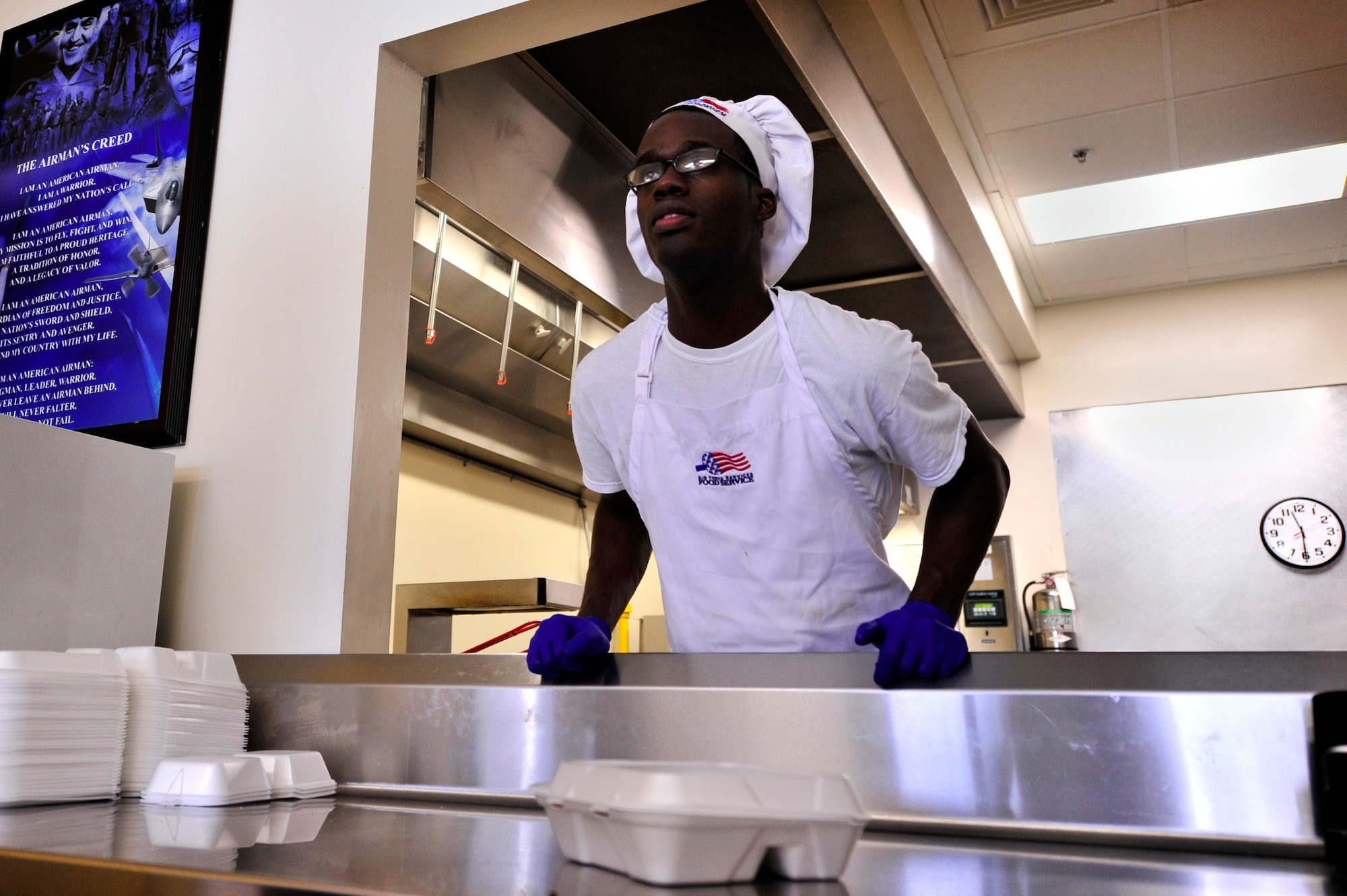 U.S. Air Force Senior Airman John Grant, 20th Force Support Squadron food service specialists, takes food orders from Airmen at the Afterburner Grill, July 20, 2012, Shaw Air Force Base, S.C. The Afterburner Grill is Shaw’s second dining facility which offers personnel working on the flightline a more accessible facility to get lunch and dinner while continuing to support Shaw’s flying mission. (U.S. Air Force photo by Senior Airman Kenny Holston/Released)