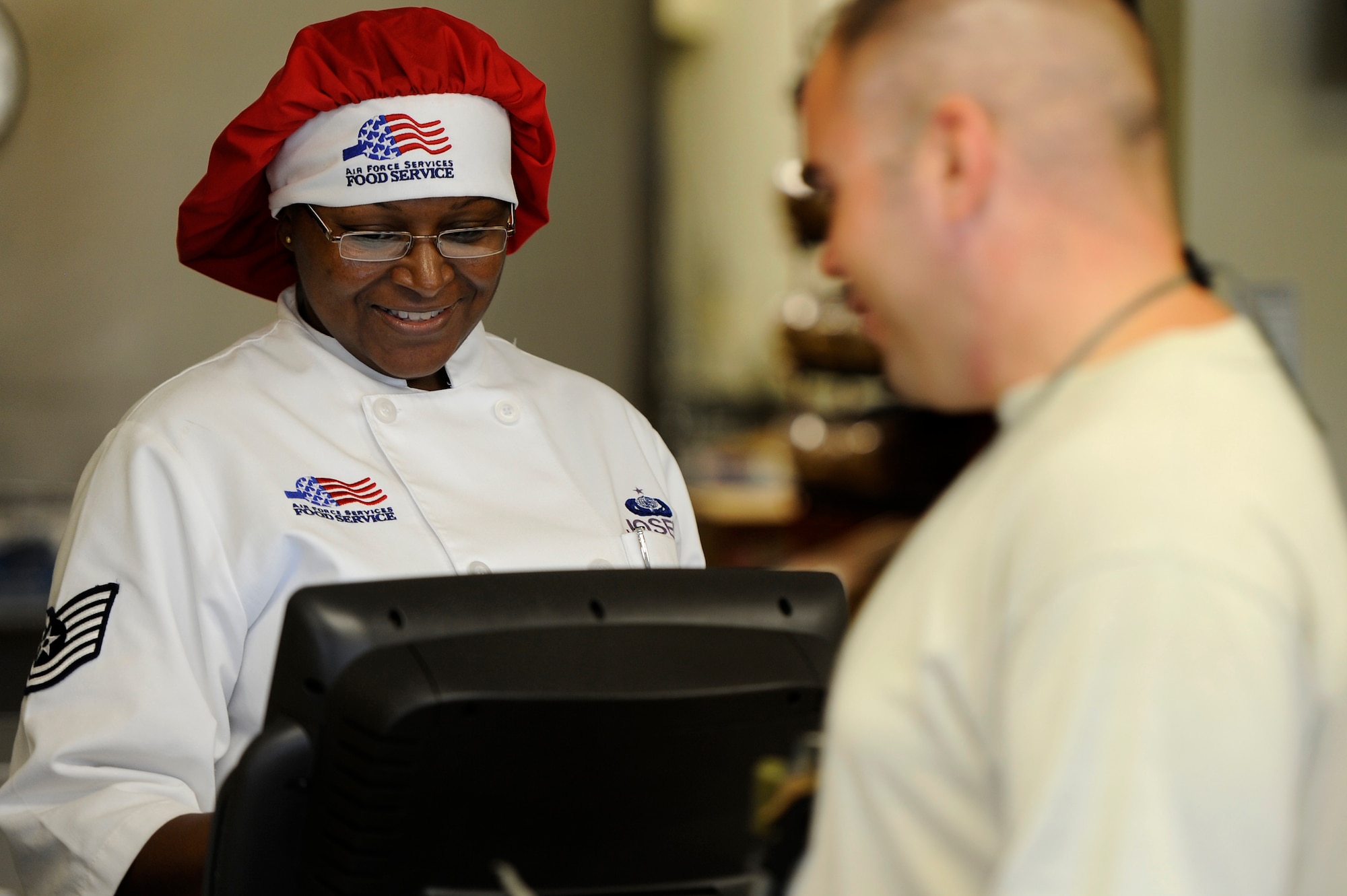 U.S. Air Force Tech. Sgt. Dorothy Joseph, 20th Force Support Squadron flightline kitchen NCOIC, rings up the meals for Airmen who have purchased lunch at the Afterburner Grill, July 20, 2012, Shaw Air Force Base, S.C. The Afterburner Grill is Shaw’s second dining facility which offers personnel working on the flightline a more accessible facility to get lunch and dinner while continuing to support Shaw’s flying mission. (U.S. Air Force photo by Senior Airman Kenny Holston/Released)