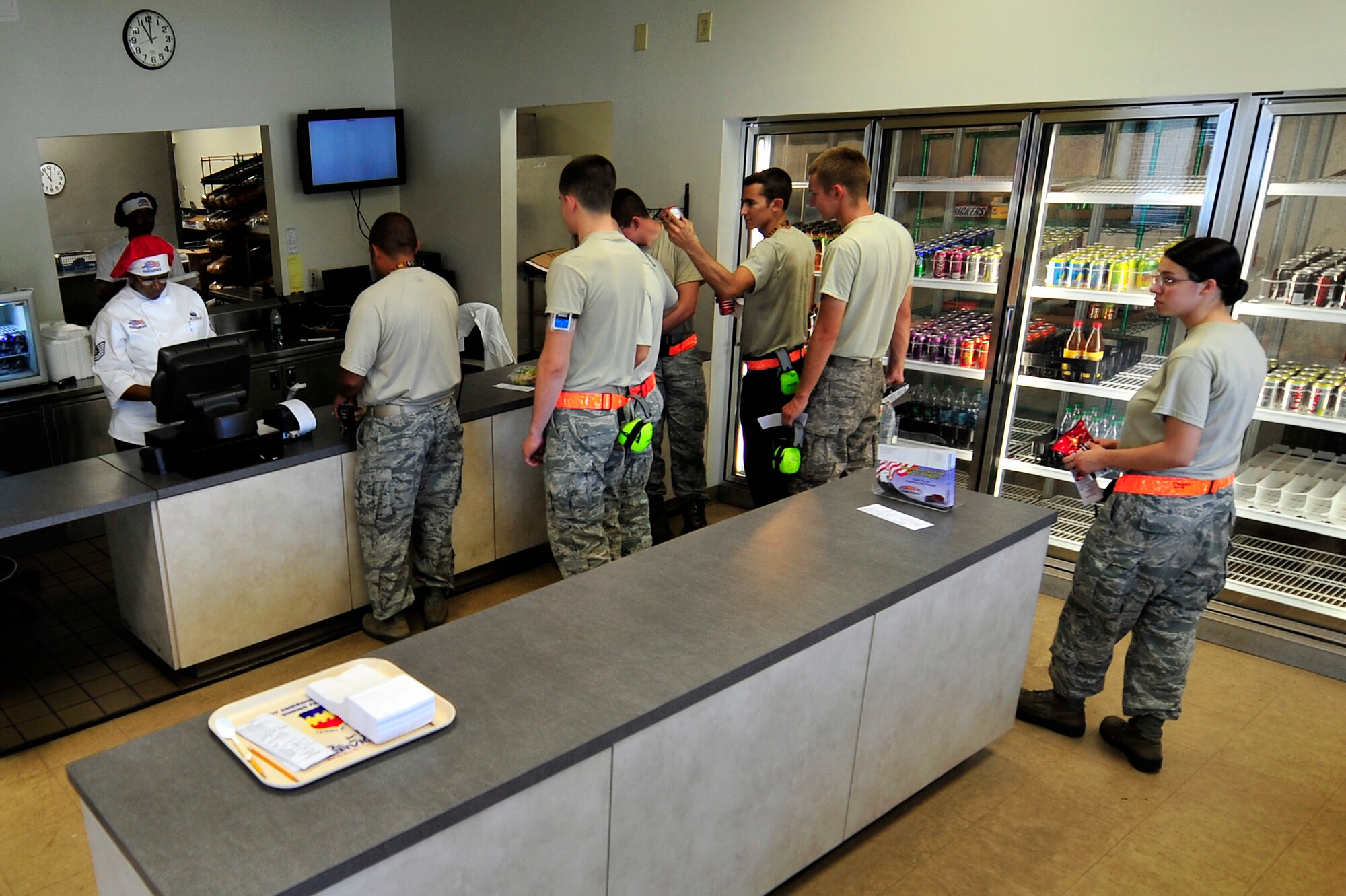 U.S. Air Force Airmen who work on the flightline grab lunch from the Afterburner Grill, July 20, 2012, Shaw Air Force Base, S.C. The Afterburner Grill is Shaw’s second dining facility which offers personnel working on the flightline a more accessible facility to get lunch and dinner while continuing to support Shaw’s flying mission. (U.S. Air Force photo by Senior Airman Kenny Holston/Released)
