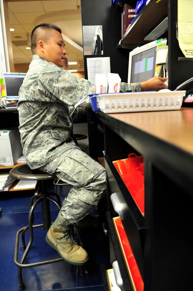 U.S. Air Force Capt. Duc Le, 20th Medical Operations Squadron pharmacist refills a prescription at Shaw Air Force Base, S.C., July 19, 2012.  Personnel working at the pharmacy dispense approximately 5,000 prescriptions per week.(U.S. Air Force photo by Airman Nicole Sikorski/Released) 
