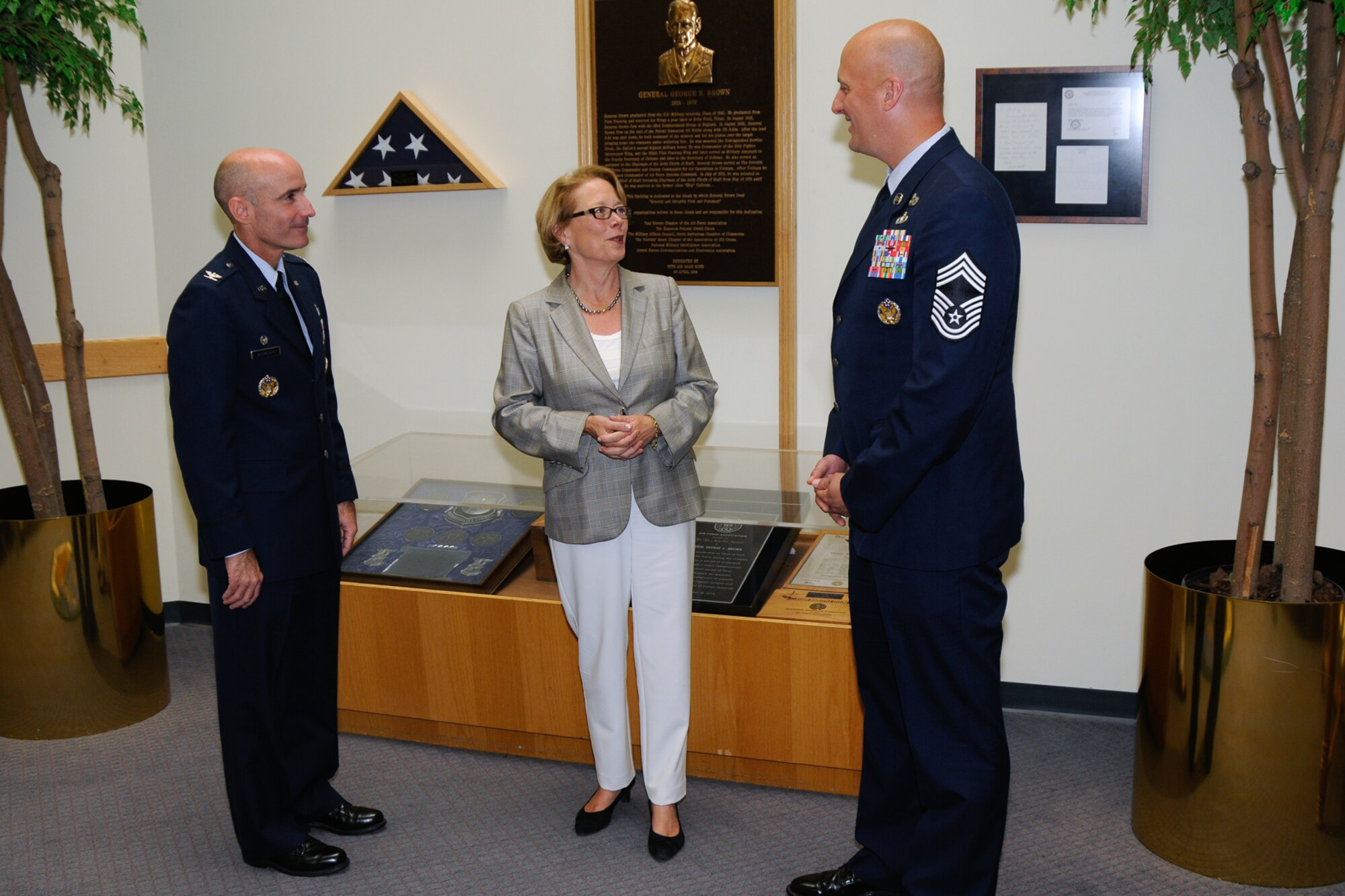 HANSCOM AIR FORCE BASE, Mass. -- U.S. Rep. Niki Tsongas chats with 66th Air Base Group Commander Col. Lester A. Weilacher (left) and Hanscom Senior Enlisted Advisor Chief Master Sgt. Baird Stiefel during the congresswoman’s visit here July 23. Tsongas expressed her strong support for the base during the visit. (U.S. Air Force photo by Linda LaBonte Britt)