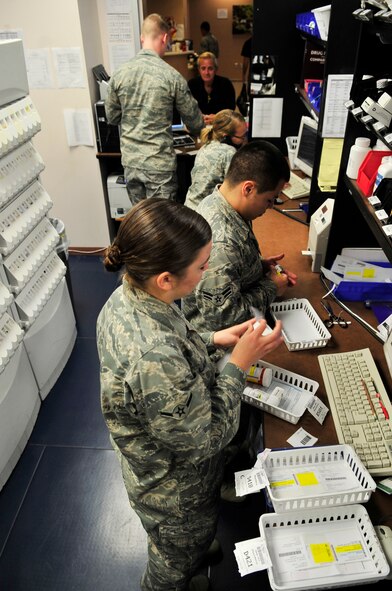 U.S. Air Force Airmen from the 20th Medical Operations Squadron pharmacy refill prescriptions  at Shaw Air Force Base, S.C, July 19, 2012.  The pharmacy provides medication for over 31,000 beneficiaries.(U.S. Air Force photo by Airman Nicole Sikorski/Released) 
