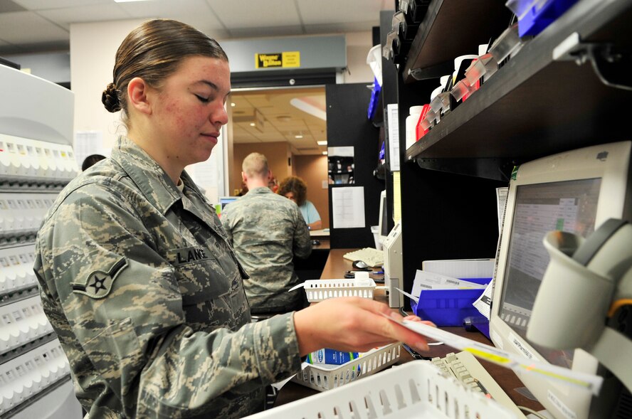 U.S. Air Force Airman 1st Class Jodi Lange, 20th Medical Group pharmacy technician, fills a prescription at Shaw Air Force Base, S.C., July 19, 2012. Personnel working at the pharmacy dispense  approximately 5,000 prescriptions per week.(U.S. Air Force photo by Airman Nicole Sikorski/Released) 