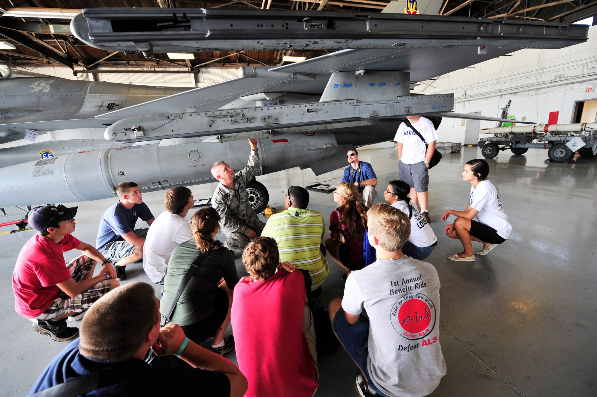 U.S. Air Force Staff Sgt. Daniel Grigg, 20th Maintenance Operation Squadron weapons expediter, talks about the  F-16 Fighting Falcon during one of the Celebrate Freedom Foundation base tours, Shaw Air Force Base, S.C., July 17, 2012.  The aviation aerospace summer campers were split up into two flights for the tour, the Seahawks and the Fighting Falcons.(U.S. Air Force photo by Airman Nicole Sikorski/Released) 