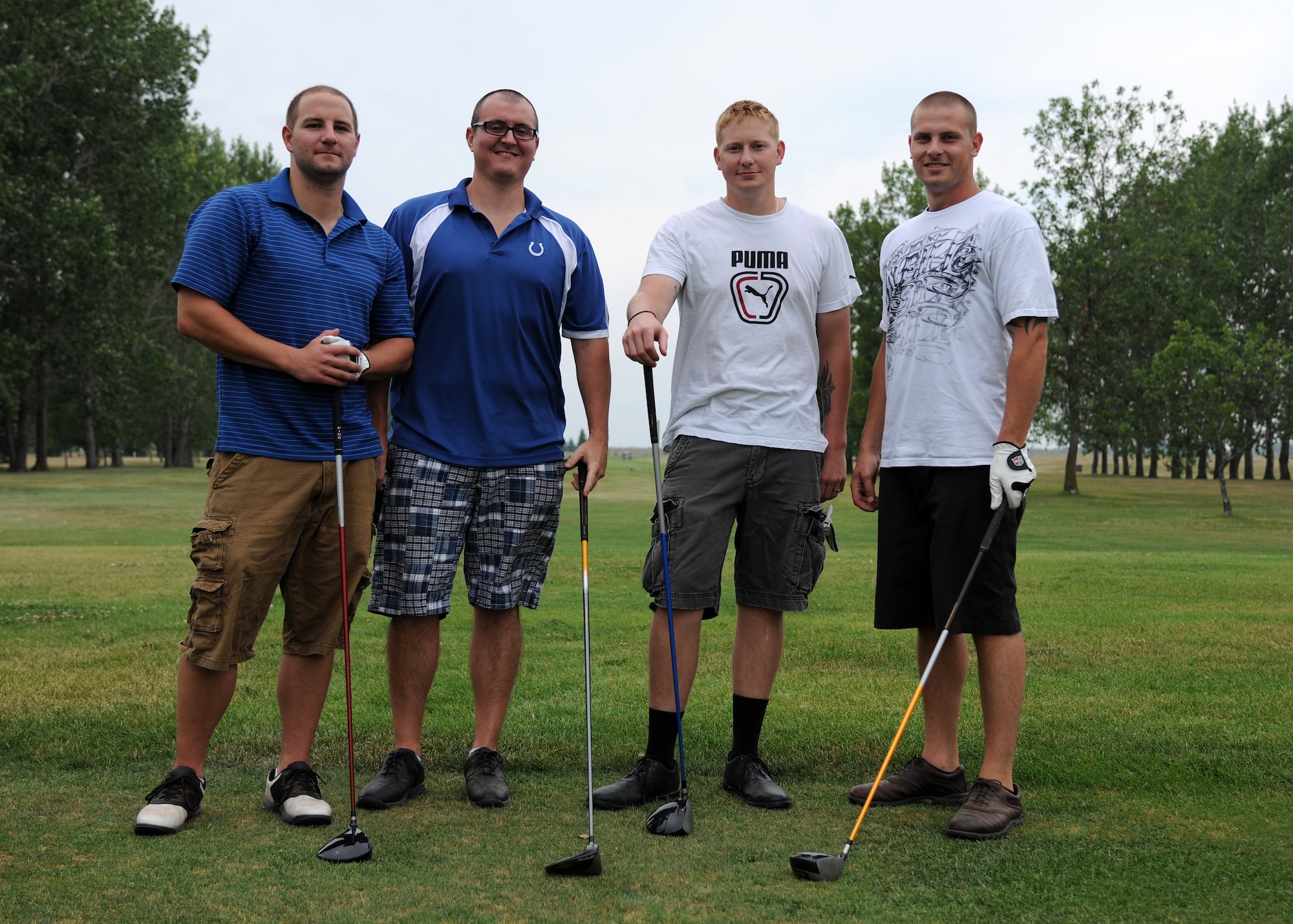 (From left) Staff Sgt. Matthew Wittman, Staff Sgt. Joseph Lipske, Airman Adam Sinclair and Senior Airman David Koerting, 319th Operations Support Squadron, pause for a team photo during the Airmen Against Drunk Driving Golf Tournament, July 23, 2012, at the Plainsview Golf Course on Grand Forks Air Force Base, N.D.  The tournament was held to raise money for AADD, which provides free, safe and confidential rides to military, family members and Department of Defense civilians who need a ride after drinking.  (U.S. Air Force photo/Airman 1st Class Ashley N. Taylor)