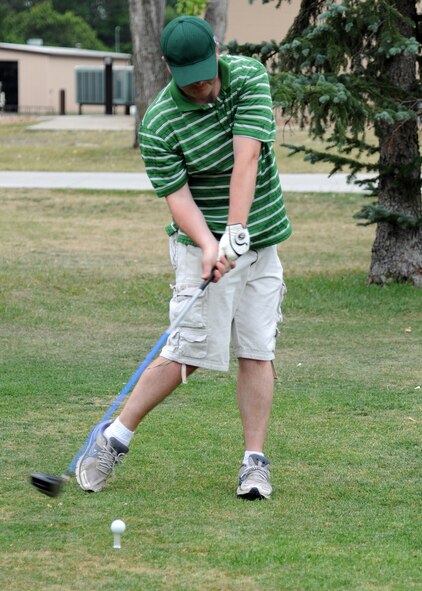 Master Sgt. Robert Becker, 69th Maintenance Squadron, drives the ball from the tee during the Airmen Against Drunk Driving Golf Tournament, July 23, 2012, at the Plainsview Golf Course on Grand Forks Air Force Base, N.D.  The tournament was held to raise money for AADD, which provides free, safe and confidential rides to military, family members and Department of Defense civilians who need a ride after drinking.  (U.S. Air Force photo/Airman 1st Class Ashley N. Taylor)   