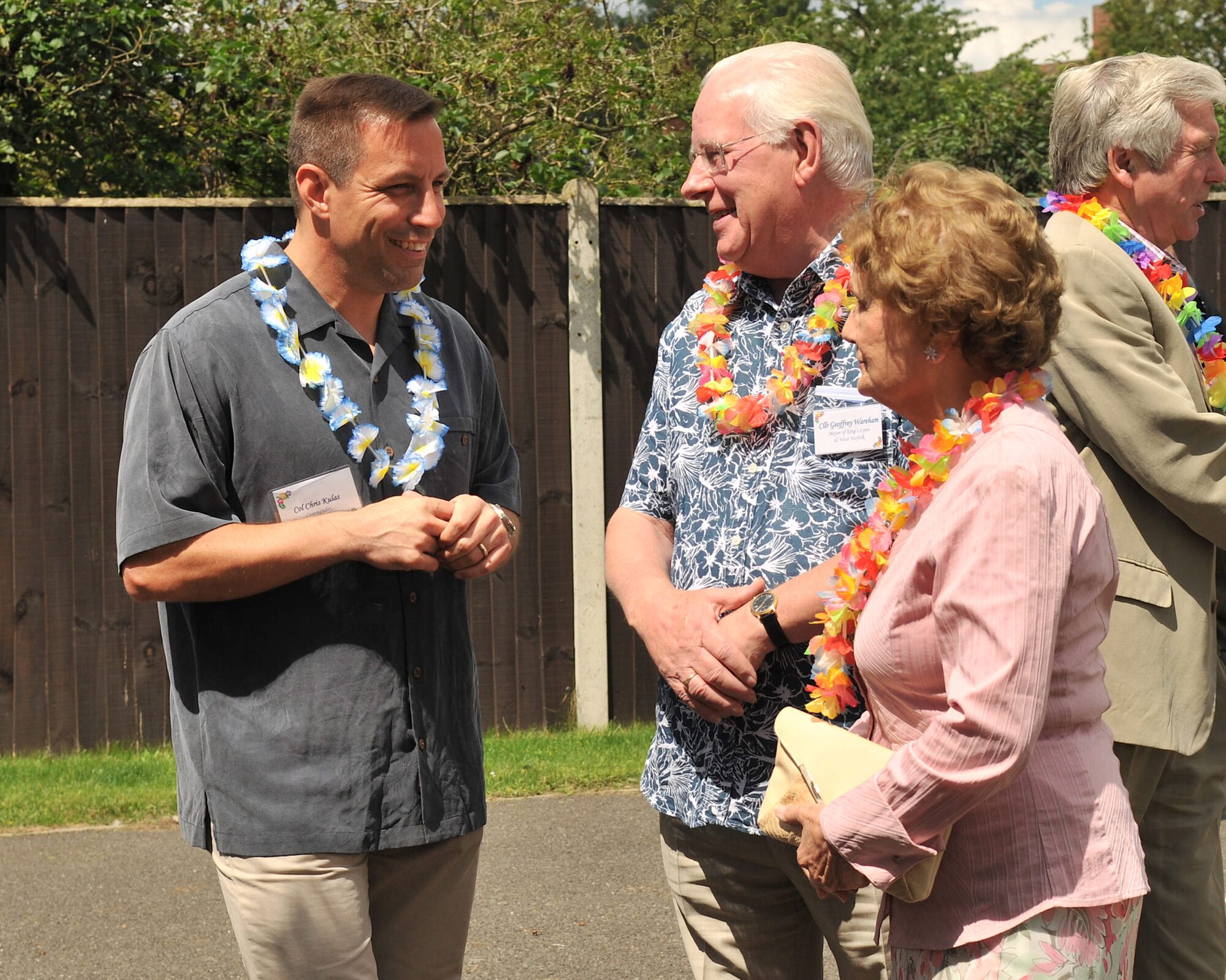 RAF MILDENHALL, England – Col. Christopher Kulas, left, 100th Air Refueling Wing commander, speaks to Councillor Geoffrey Wareham and his wife Mary, during the New Mayor’s Barbecue held on base July 21, 2012. The event consisted of wing mission and economic impact briefs and ended with a Hawaiian luau-themed social. (U.S. Air Force photo/Senior Airman Jerilyn Quintanilla)