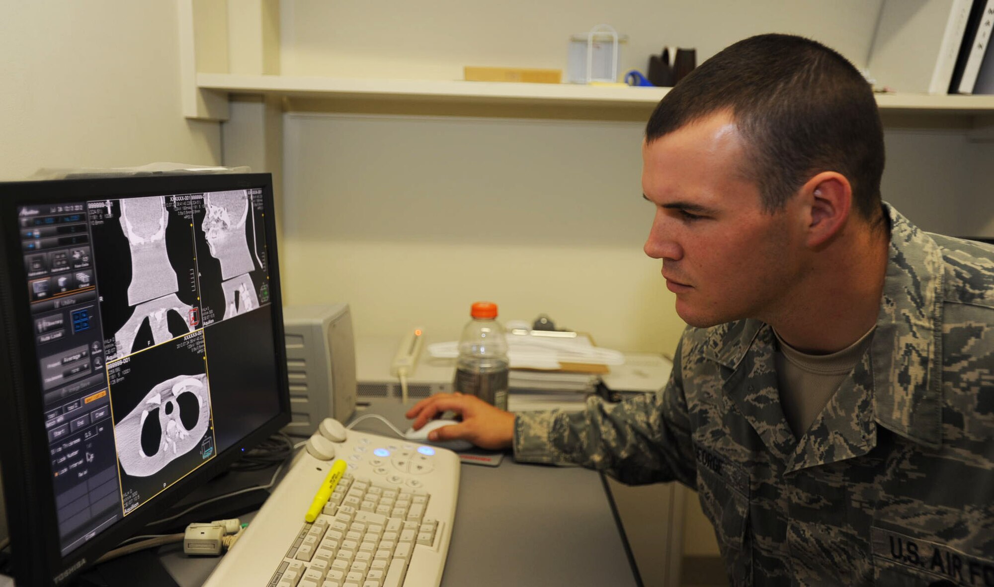 U.S. Air Force Staff Sgt. Mike George, 35th Medical Group diagnostic imaging technologist, studies scans for anything to signify a patient’s health is threatened at Misawa Air Base, Japan, July 24, 2012. On this screen, the technologist is able to study the scans and control what parts of the body he wishes to see in 3D. (U.S. Air Force photo by Airman 1st Class Kenna Jackson/Released)
