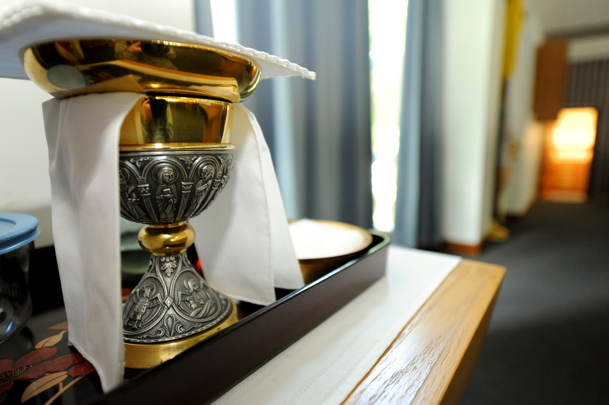 A chalice is placed out at Chapel 1 before Catholic service on Kadena Air Base Japan, July 24, 2012. Chaplain assistants like Staff Sgt. Rachal Barnes, help set up the chapels prior to services and provide administrative support for the chapel staff. (U.S. Air Force photo/Airman 1st Class Brooke P. Beers)