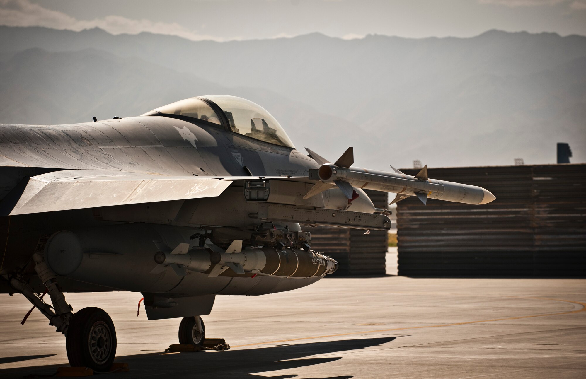 A U.S. Air Force F-16 Fighting Falcon assigned to Kandahar Airfield sits on the ramp at Bagram Airfield, Afghanistan, July 21, 2012. Commonly called the ‘Viper’ by its aircrews, the F-16 is a proven multirole fighter that has provided flexible support to ground forces in Afghanistan over the past decade. (U.S. Air Force Photo/Capt. Raymond Geoffroy)