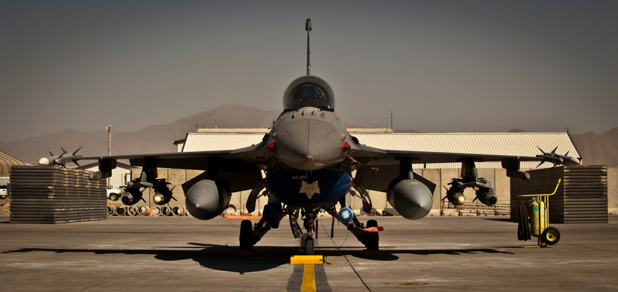 A U.S. Air Force F-16 Fighting Falcon assigned to Kandahar Airfield sits on the ramp at Bagram Airfield, Afghanistan, July 21, 2012. Several F-16s were temporarily moved to Bagram while Airmen made improvements to Kandahar’s ramp. (U.S. Air Force Photo/Capt. Raymond Geoffroy)