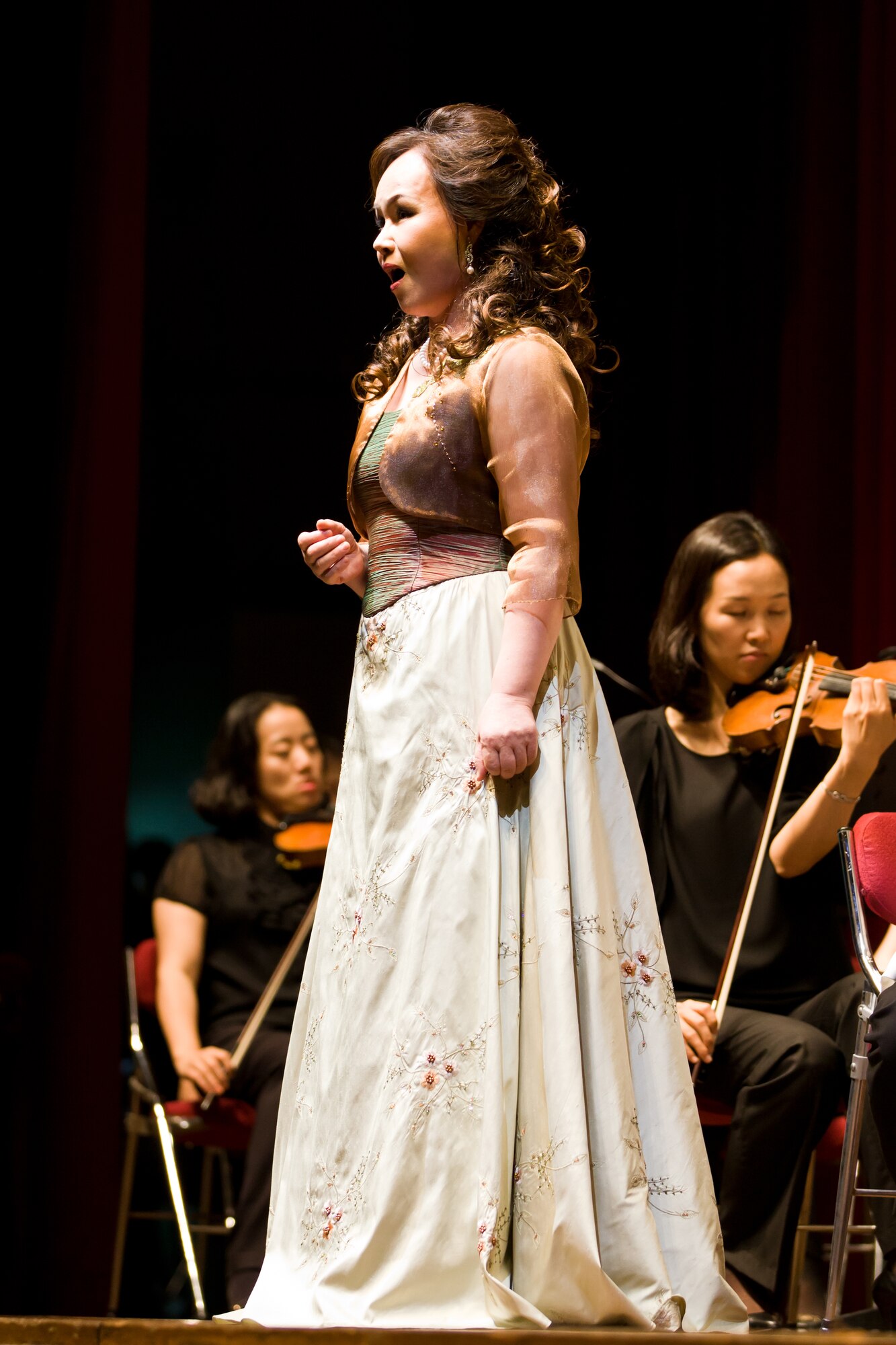 A songstress performing with the Gunsan Philharmonic Orchestra sings an opera song during a show July 20, 2012, in Gunsan City, South Korea. Several Airmen from nearby Kunsan Air Base attended the show to get a taste of Korean culture. (U.S. Air Force photo/Tech. Sgt. Kevin Crawford)
