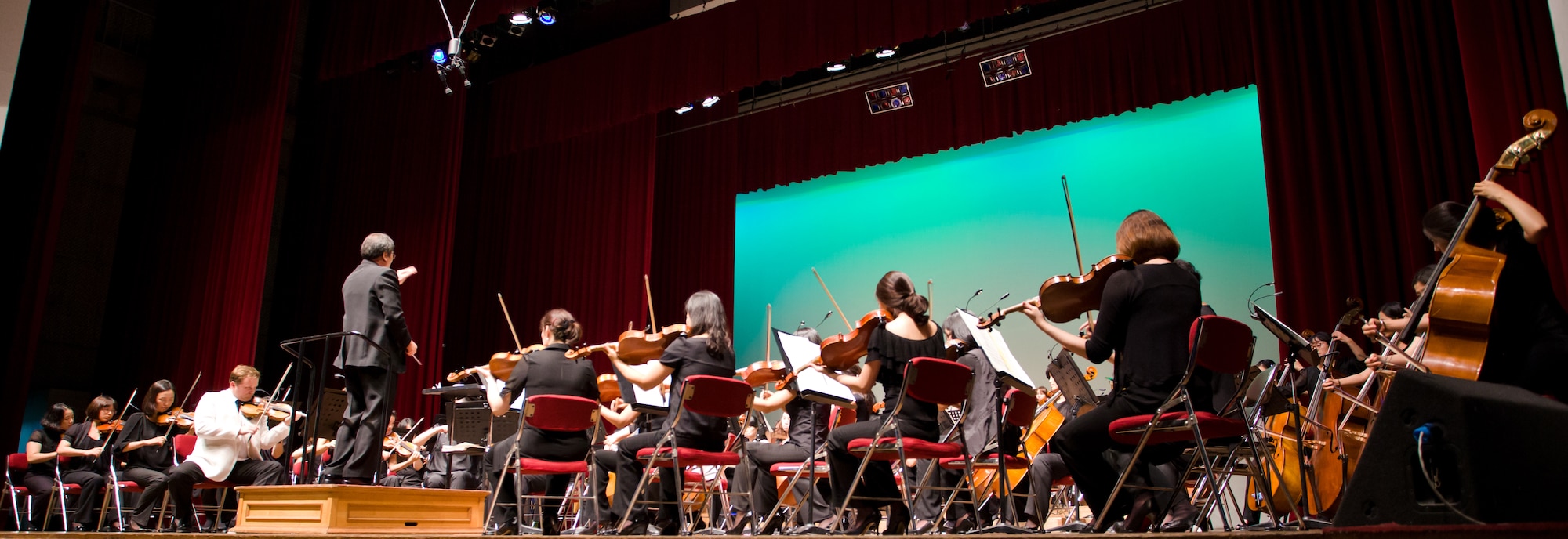The Gunsan Philharmonic Orchestra performs for an audience of locals and Airmen from Kunsan Air Base during a show July 20, 2012, in Gunsan City, South Korea. Although spoken language is sometimes a barrier, music provides a common ground for many cultures. (U.S. Air Force photo/Tech. Sgt. Kevin Crawford)