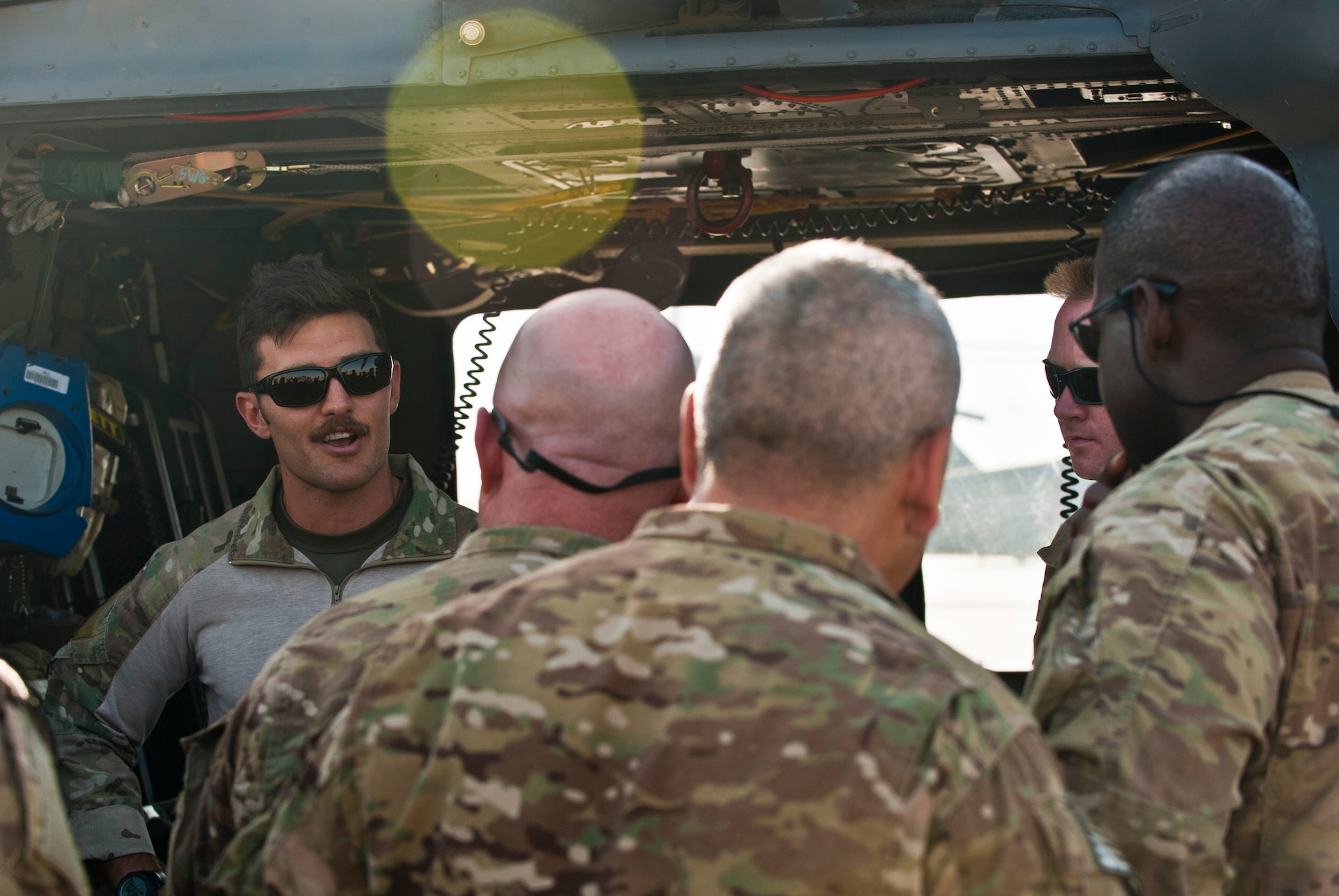 A pararescueman assigned to the 83rd Expeditionary Rescue Squadron brief a group of senior enlisted leaders on the Air Force combat search and rescue during a 455th Air Expeditionary Wing orientation tour at Bagram Airfield, Afghanistan, July 21, 2012. The visit gave the senior enlisted leaders a better understanding of the CSAR mission and the capabilities provided by 83 ERQS Airmen. (U.S. Air Force Photo/Capt. Raymond Geoffroy)