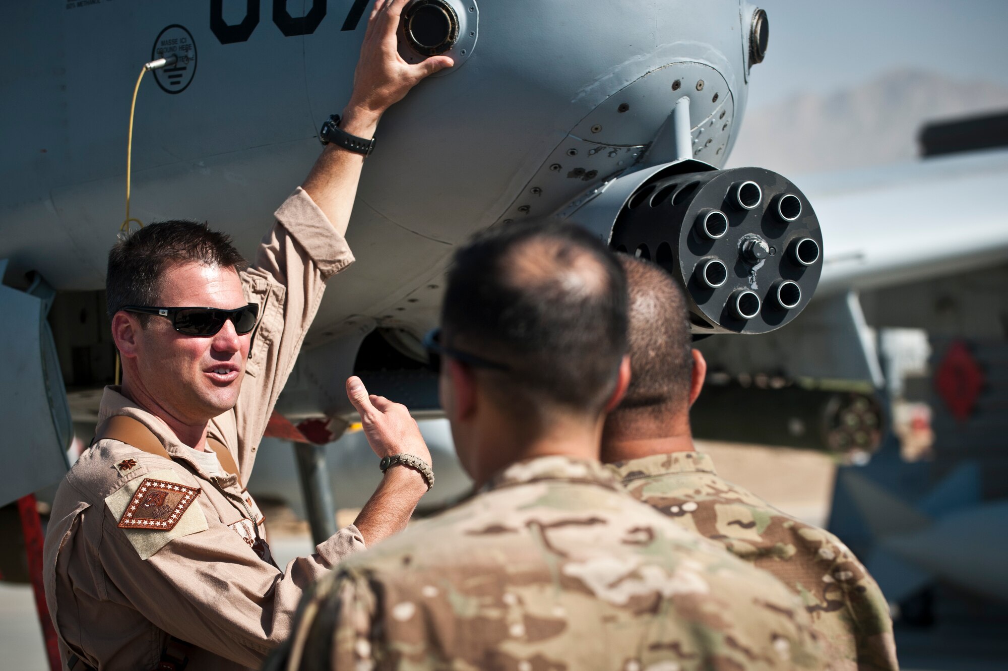 A pilot assigned to the 104th Expeditionary Fighter Squadron shows a U.S. Air Force A-10 Thunderbolt II to a visiting group of senior enlisted leaders during a 455th Air Expeditionary Wing orientation tour at Bagram Airfield, Afghanistan, July 21, 2012. The visit gave the senior enlisted leaders a better understanding of the A-10s capabilities to support the warfighter on the ground. (U.S. Air Force Photo/Capt. Raymond Geoffroy)