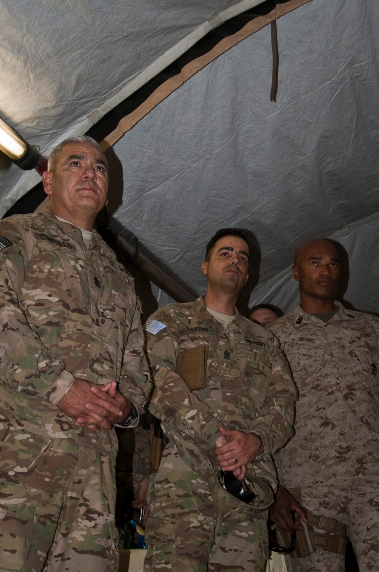 A group of senior enlisted leaders walk listen to a briefing at the Contingency Aero-medical Staging Facility during a 455th Air Expeditionary Wing orientation tour at Bagram Airfield, Afghanistan, July 21, 2012. The enlisted leaders learned about the quality of care provided by Bagram Airmen to wounded warriors. (U.S. Air Force Photo/Capt. Raymond Geoffroy)