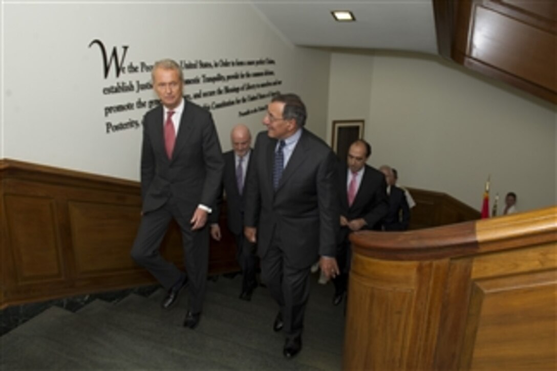 Secretary of Defense Leon E. Panetta, right, escorts Spanish Minister of Defense Pedro Morenes to a meeting in the Pentagon on July 23, 2012.  Panetta, Morenes and their senior staff will meet to discuss concerns of interest to both nations.  