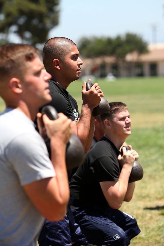Marines perform kettle-bell workouts during the Combat Conditioning Training Course at the Paige Field House on Marine Corps Base Camp Pendleton, July 24. This two-day course combines lectures and practical application to prepare Marines for combat.