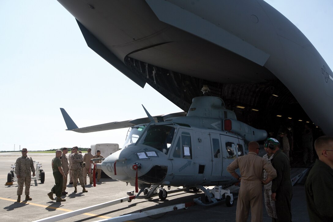 Marines with Marine Medium Helicopter Squadron 262 (Reinforced) unload a UH-1Y Venom out of a C-17 Globemaster III at Marine Corps Air Station Futenma as part of a Corpswide transition of the UH-1N to the UH-1Y helicopter May 25. HMM-262 (Rein) is a part of Marine Aircraft Group 36, 1st Marine Aircraft Group, III Marine Expeditionary Force.