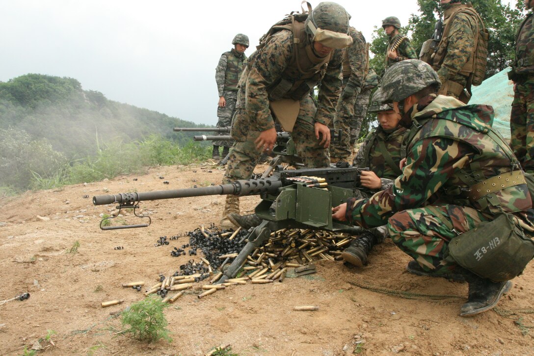 Lance Cpl. Park Seung Yeon fires the M2 machine gun as ROK and U.S. Marines observe July 23 at Nightmare Range, Republic of Korea during the Korean Marine Exchange Program 12-7. The ROK Marines also fired the Mk 19 automatic grenade launcher and conducted a fire and maneuver exercise with the U.S. Marines. The purpose of the exercise is to allow U.S. and ROK Marines to enhance and improve their combined capabilities. Yeon is with 8th Artillery Battalion, 2nd ROK Marine Division. The U.S. Marines are with 12th Marine Regiment, 3rd Marine Division, III Marine Expeditionary Force.