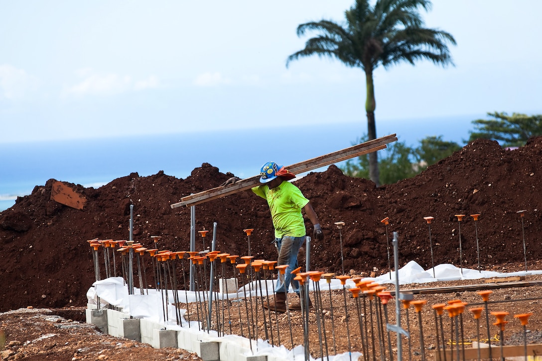 Construction workers continue to work on the new fitness center here July 18. Despite working through rainy conditions, the crew has managed to remain on schedule. The fitness center is expected to be opened by August 2013. 